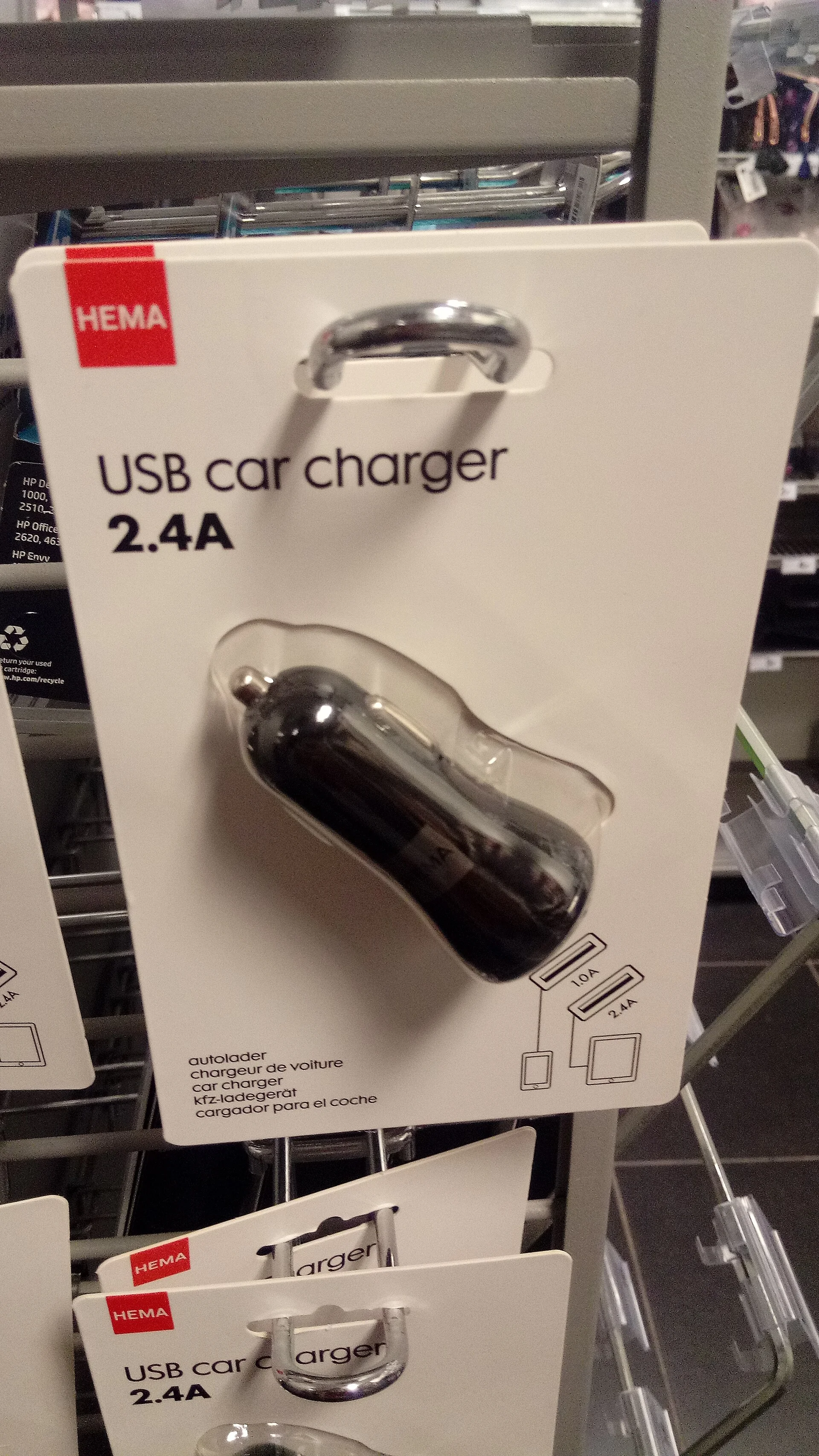A USB car charger in retail packaging, the kind of dual-port adapter reviewed here