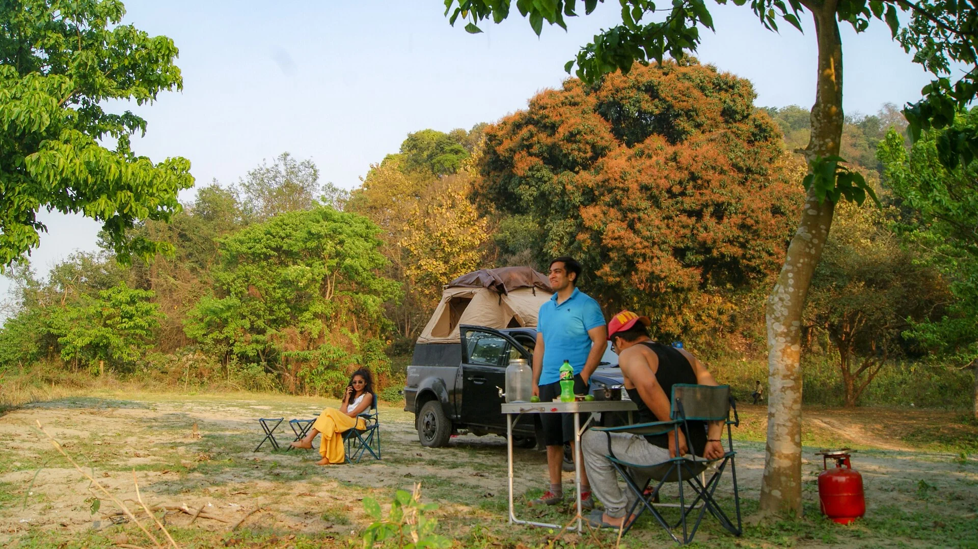 Overlanding vehicles set up at a remote campsite.