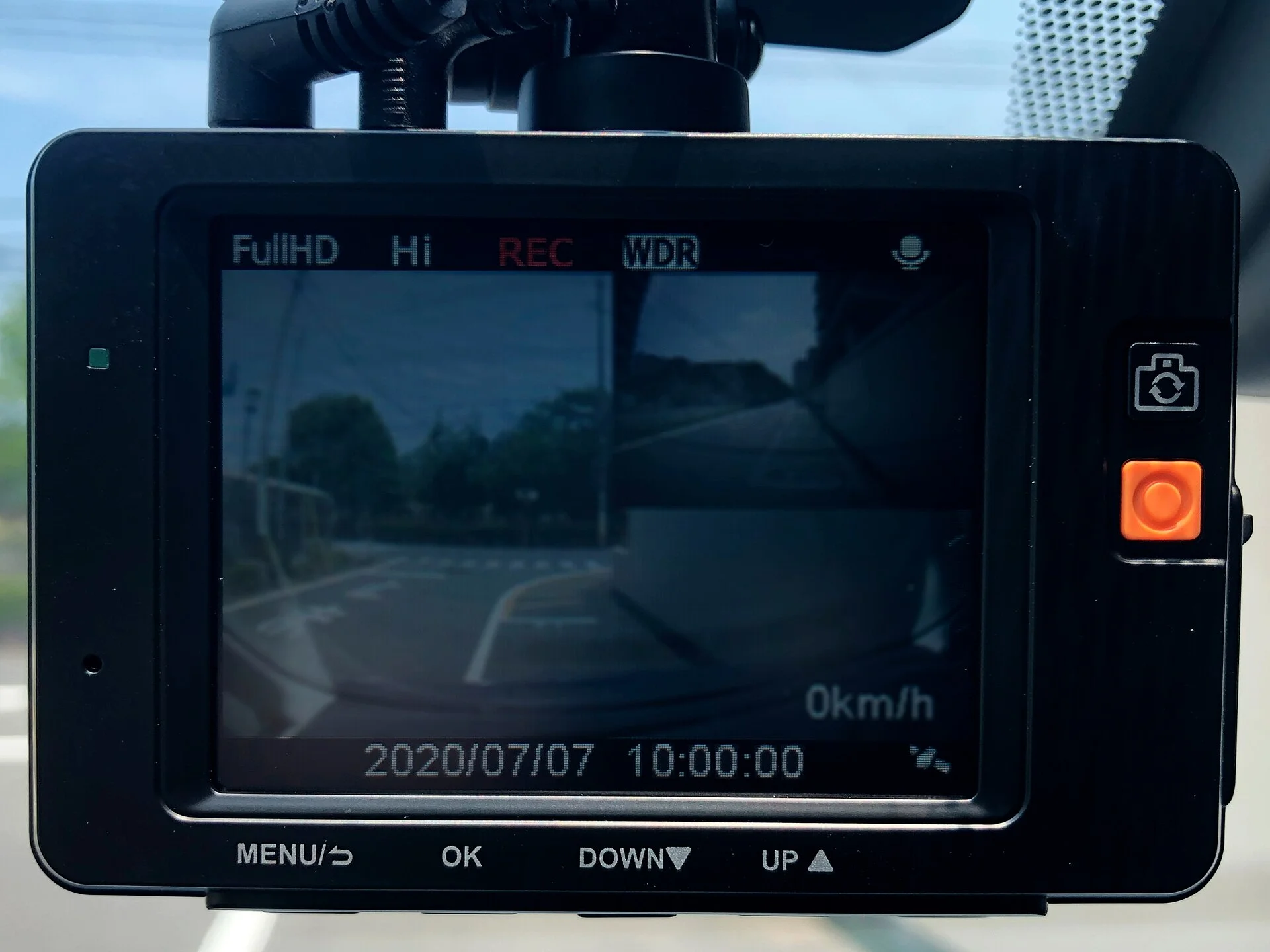 Dual dash cam with live-view screen mounted on a windshield