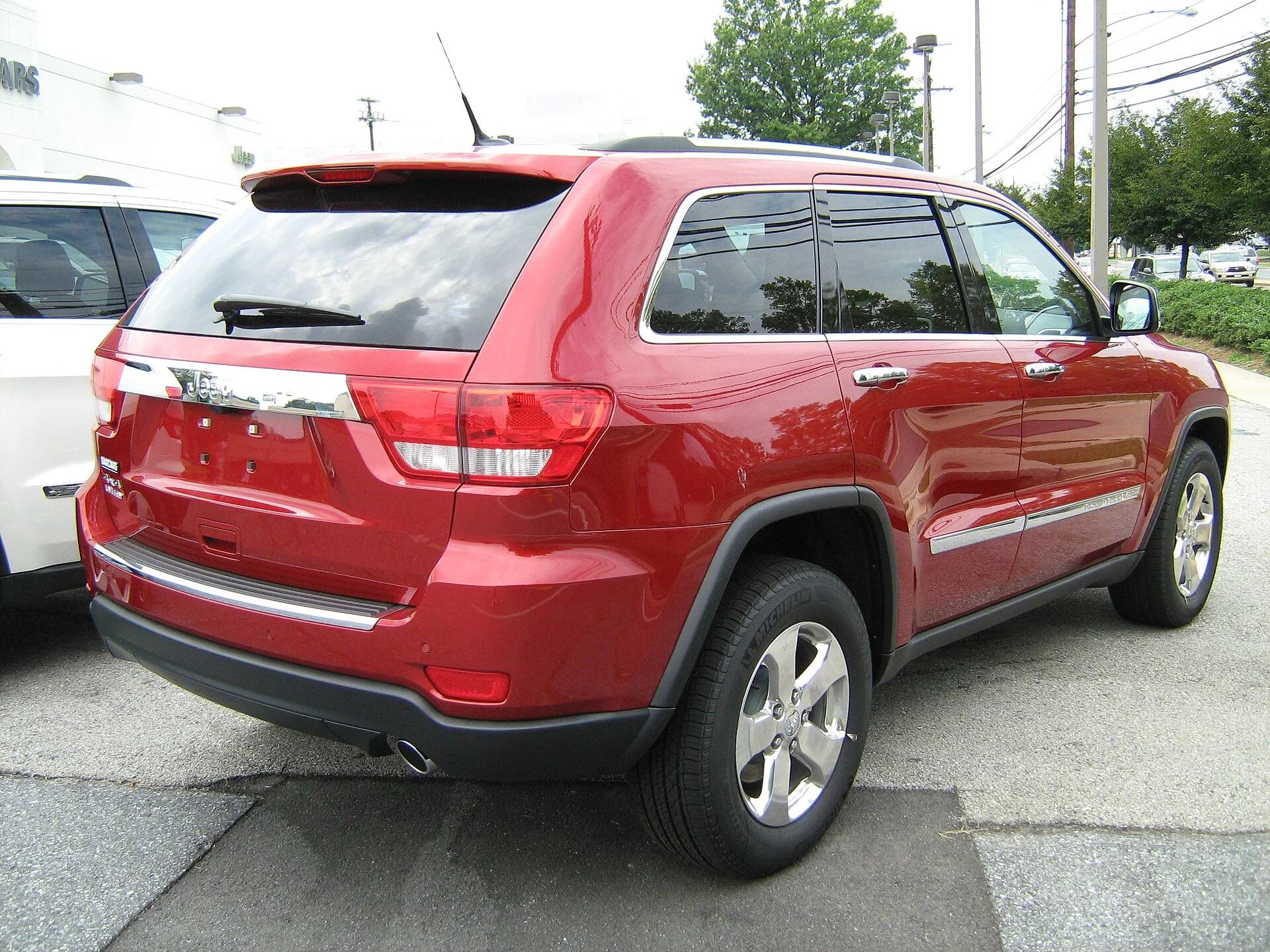 2011 Jeep Grand Cherokee Limited (WK2), rear three-quarter showing the liftgate and cargo access