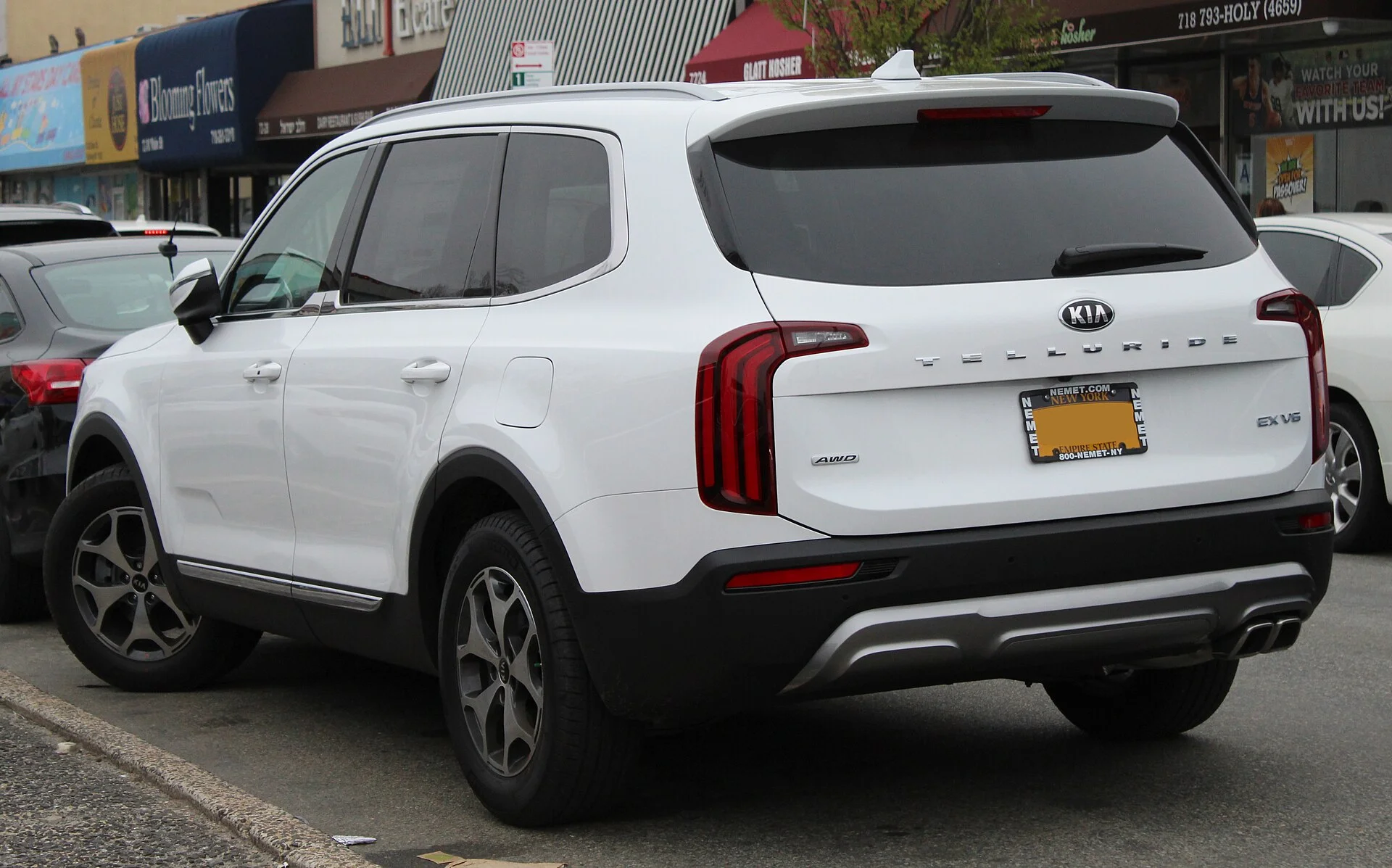 A Kia Telluride three-row SUV (rear view), the vehicle this car camping guide evaluates for sleeping.