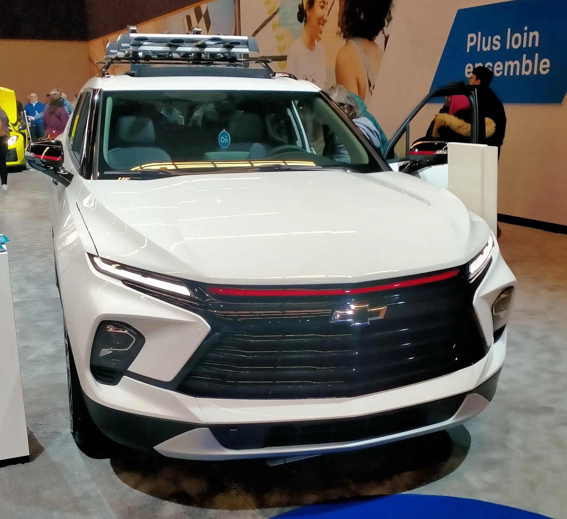 A Chevrolet Blazer mid-size SUV fitted with a roof rack and cargo load, illustrating a camping setup.
