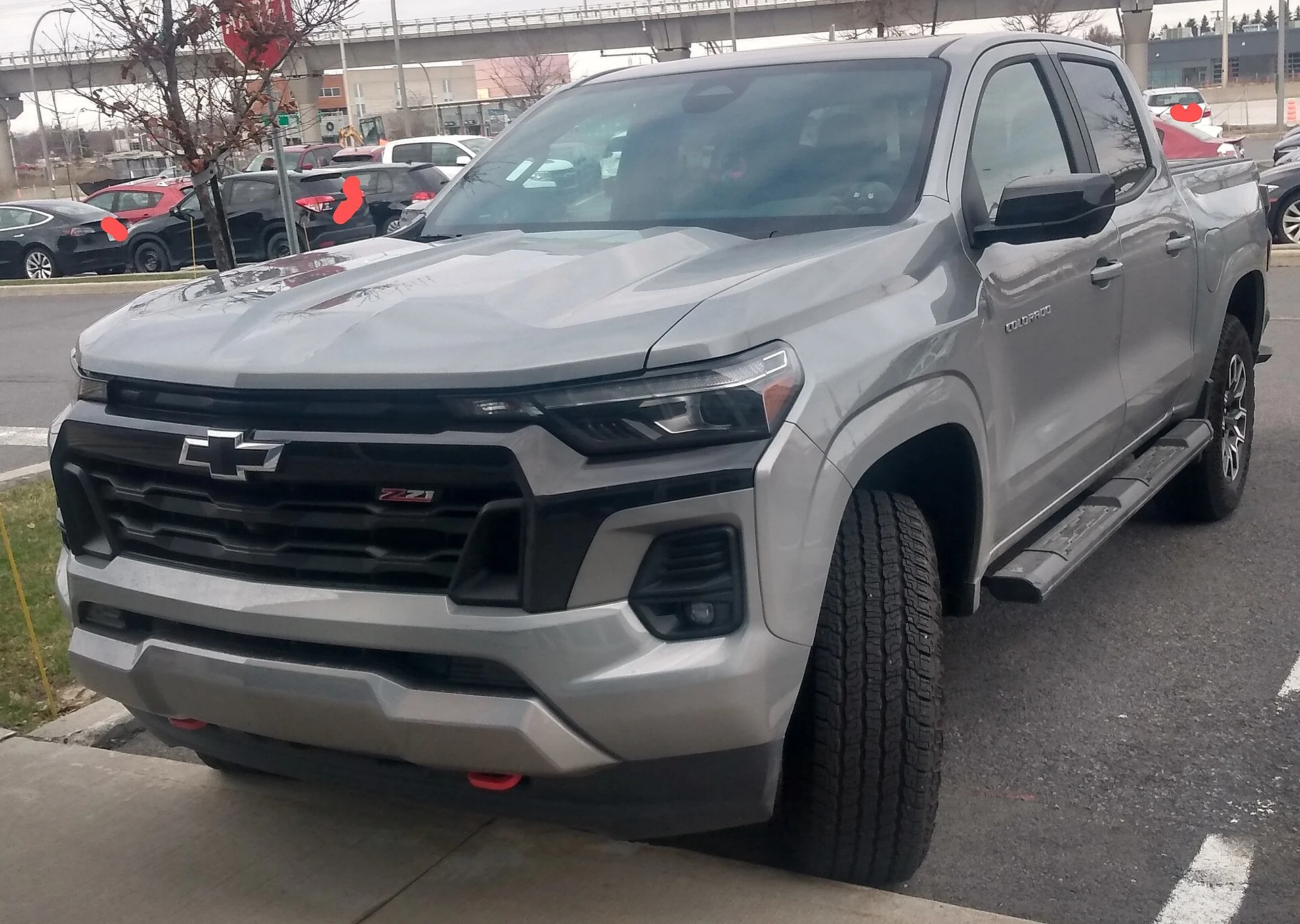 Chevy Colorado Z71 — a grey 2023 Colorado, front three-quarter view