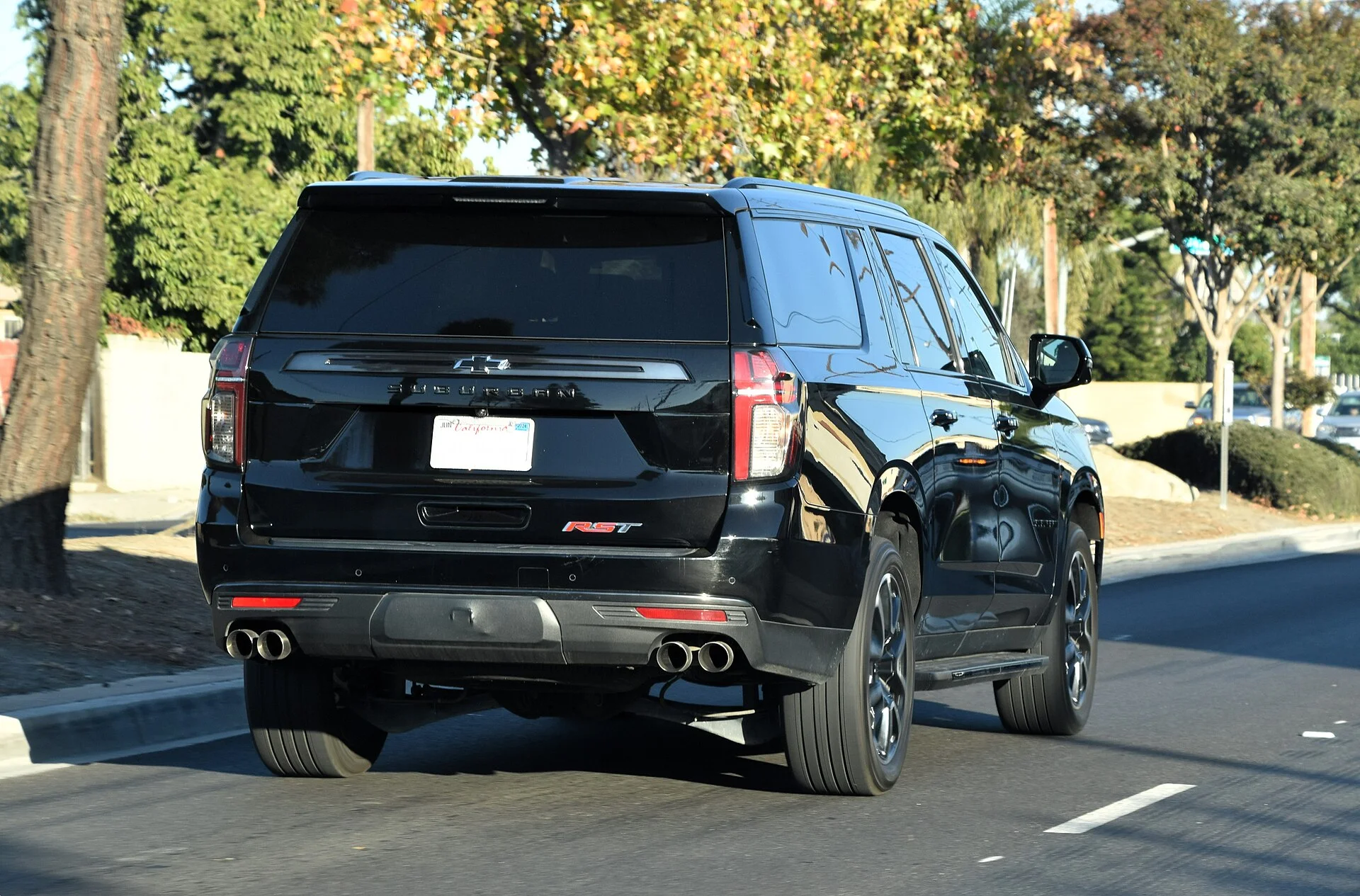 Chevy Suburban RST — a maroon 2022 Suburban, rear three-quarter view
