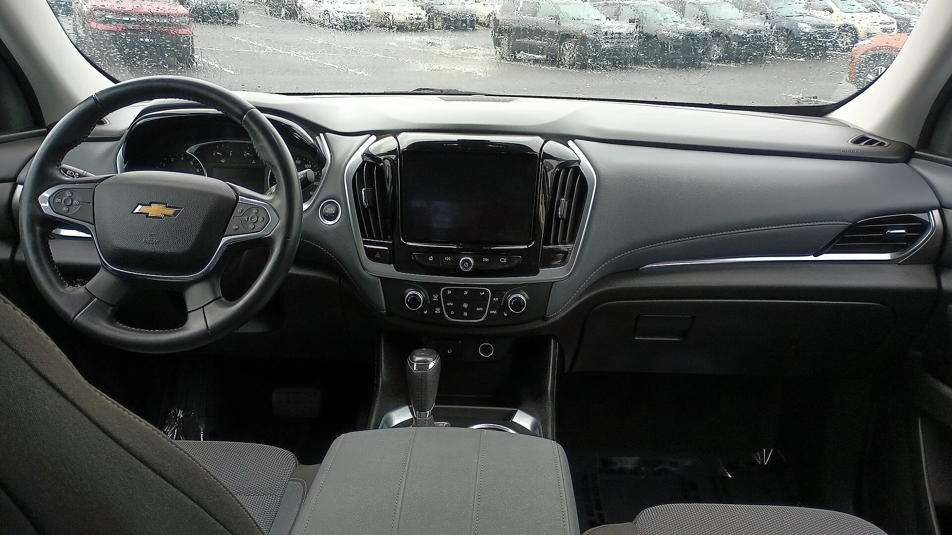 Chevy Traverse interior — the dashboard, center console and touchscreen of a 2019 Traverse