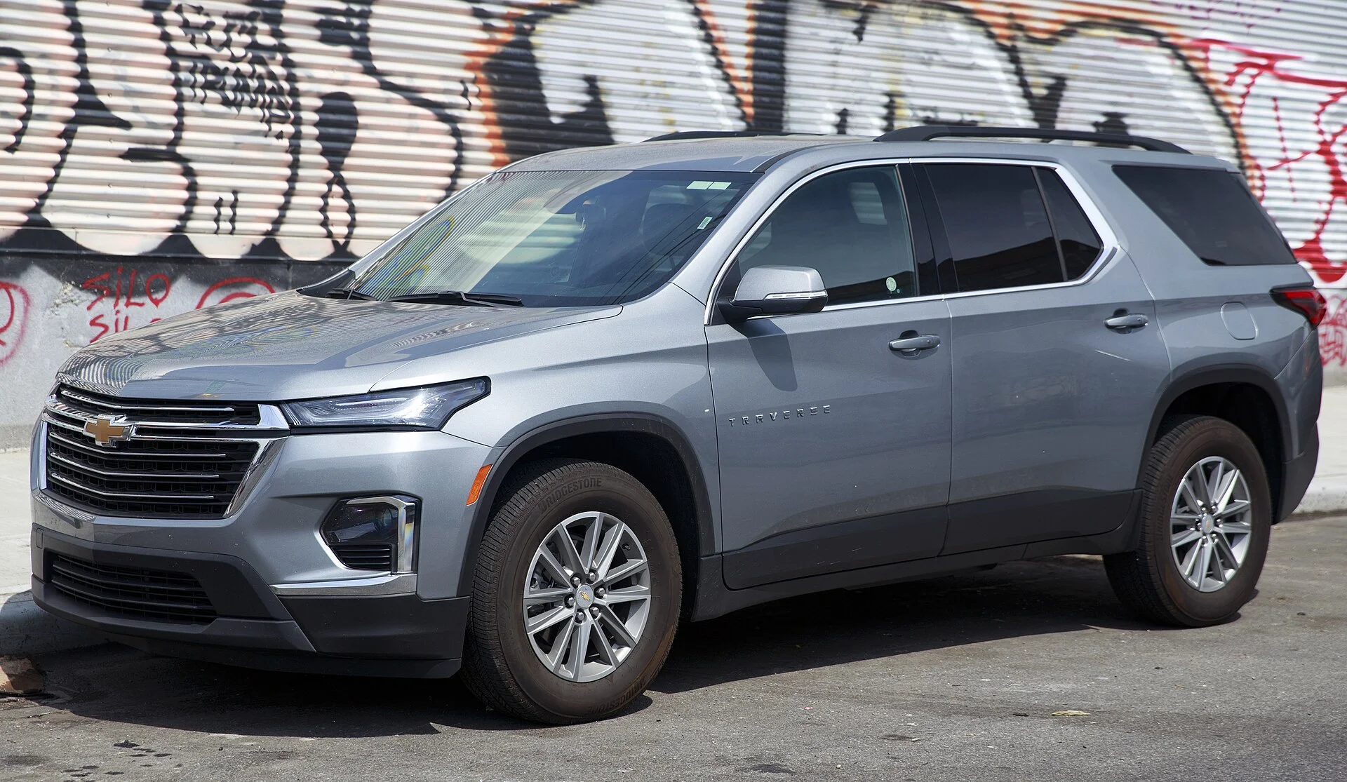 Chevy Traverse LT — a silver-blue 2023 Traverse, front three-quarter view