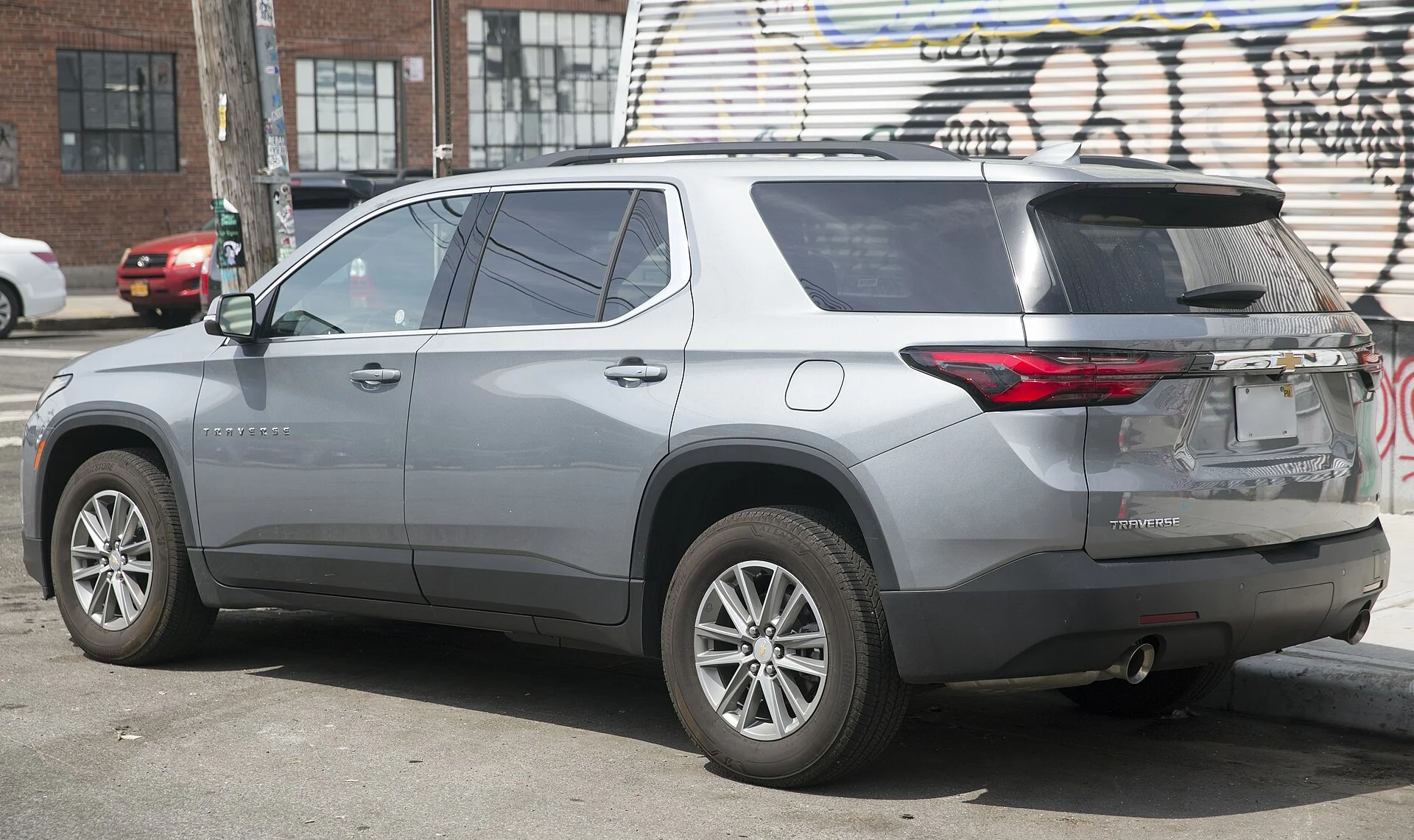 Chevy Traverse LT — a silver 2023 Traverse, rear three-quarter view