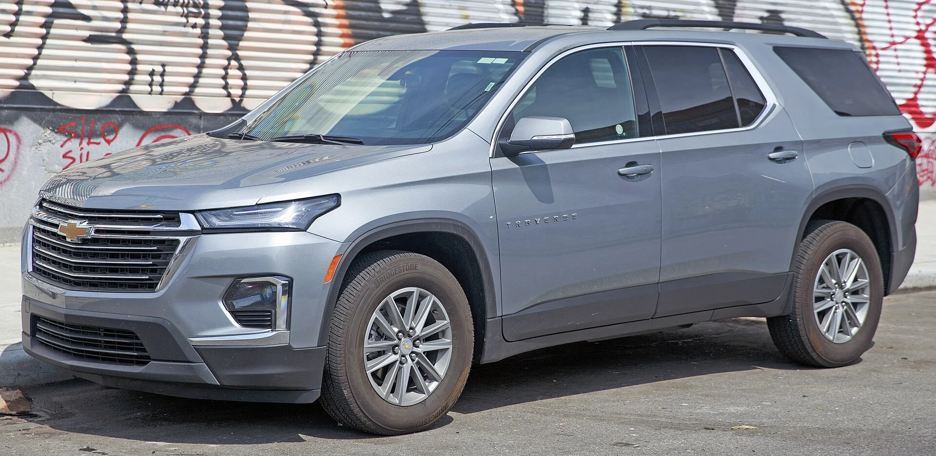 Chevy Traverse LT — a grey 2023 Traverse, front three-quarter view