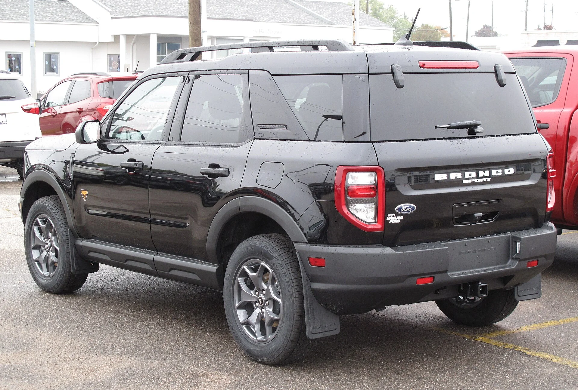 A Ford Bronco Sport (rear view), showing the liftgate and cargo area used for a sleeping setup.