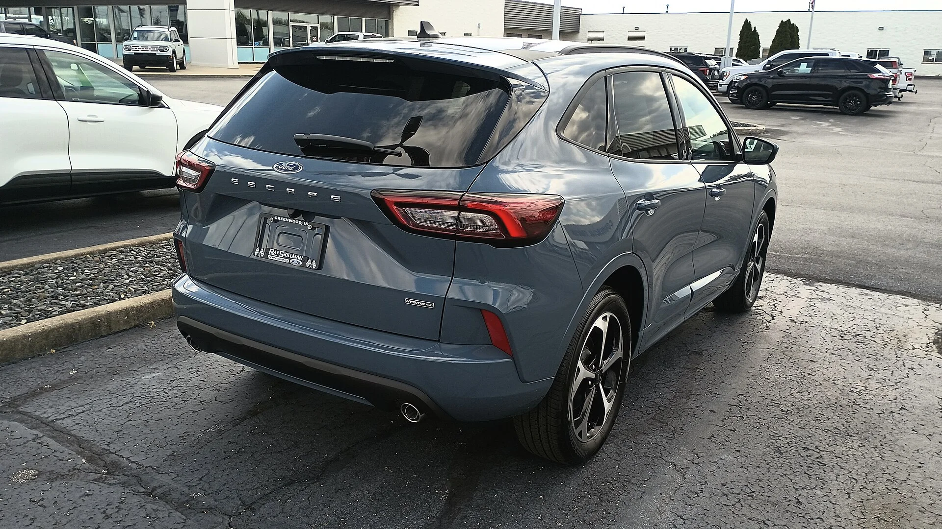 Ford Escape ST-Line — a white 2023 Escape, rear three-quarter view