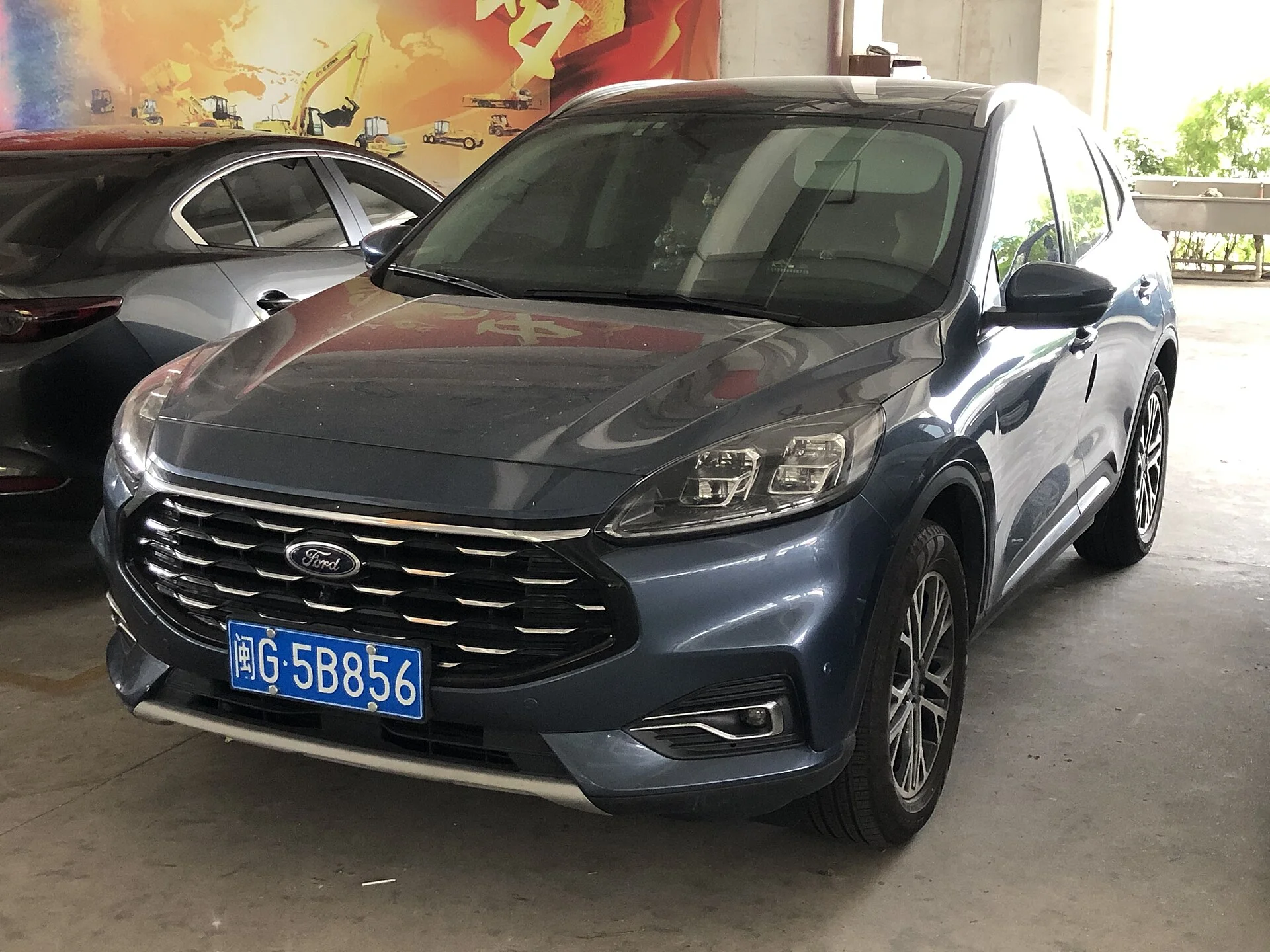 Ford Escape — a dark-grey 2023 Escape, front three-quarter view