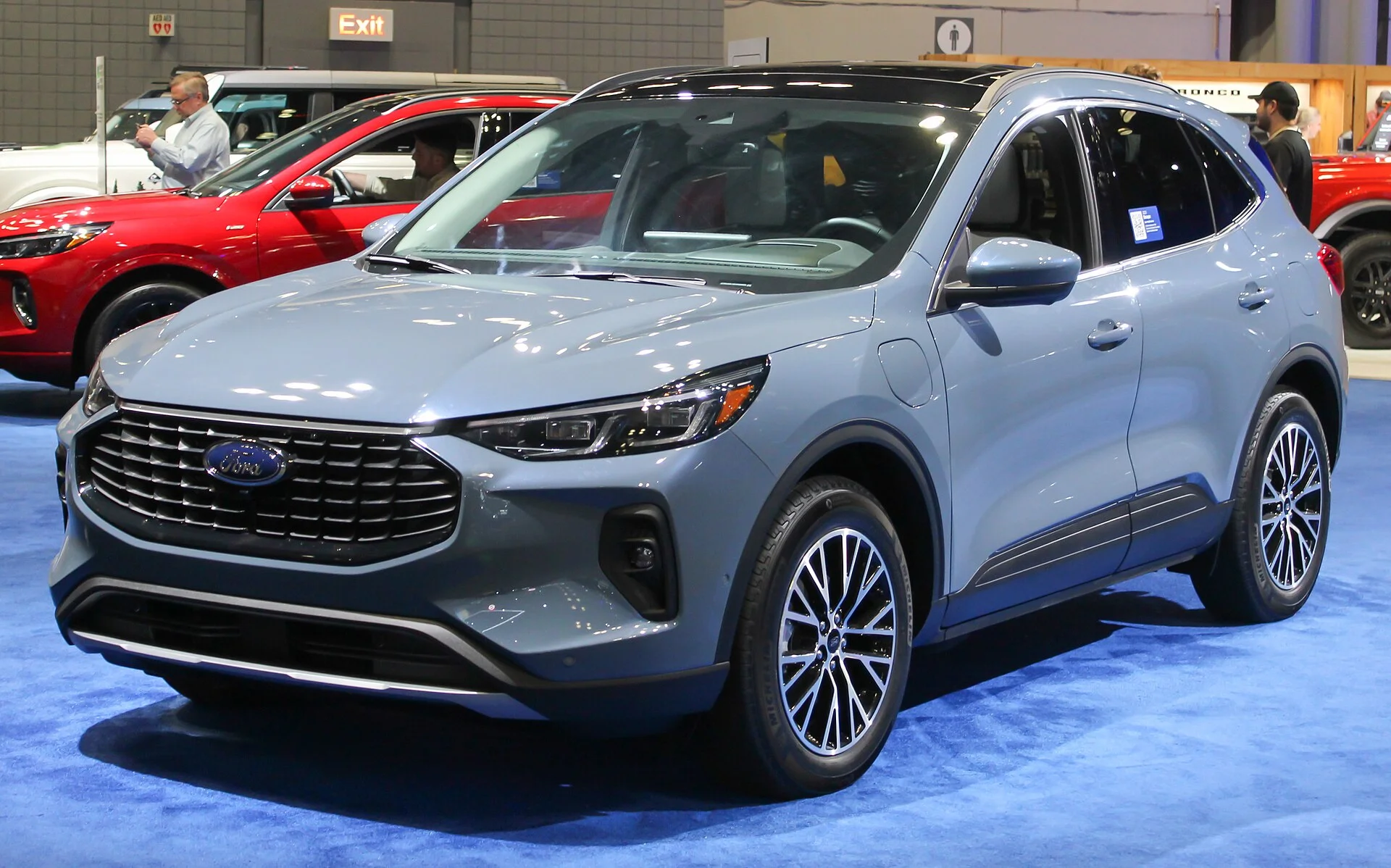 Ford Escape Plug-In Hybrid — a light-blue 2023 Escape, rear three-quarter view