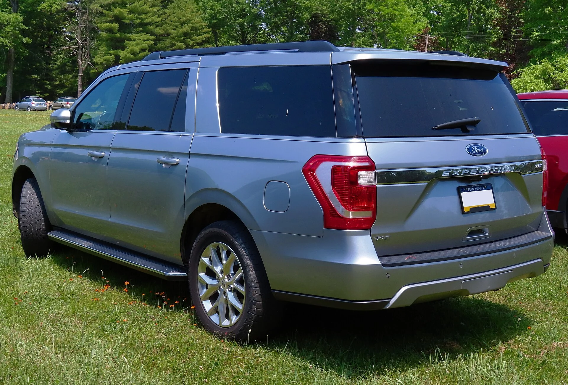 Ford Expedition XLT MAX — a silver 2021 Expedition, rear three-quarter view