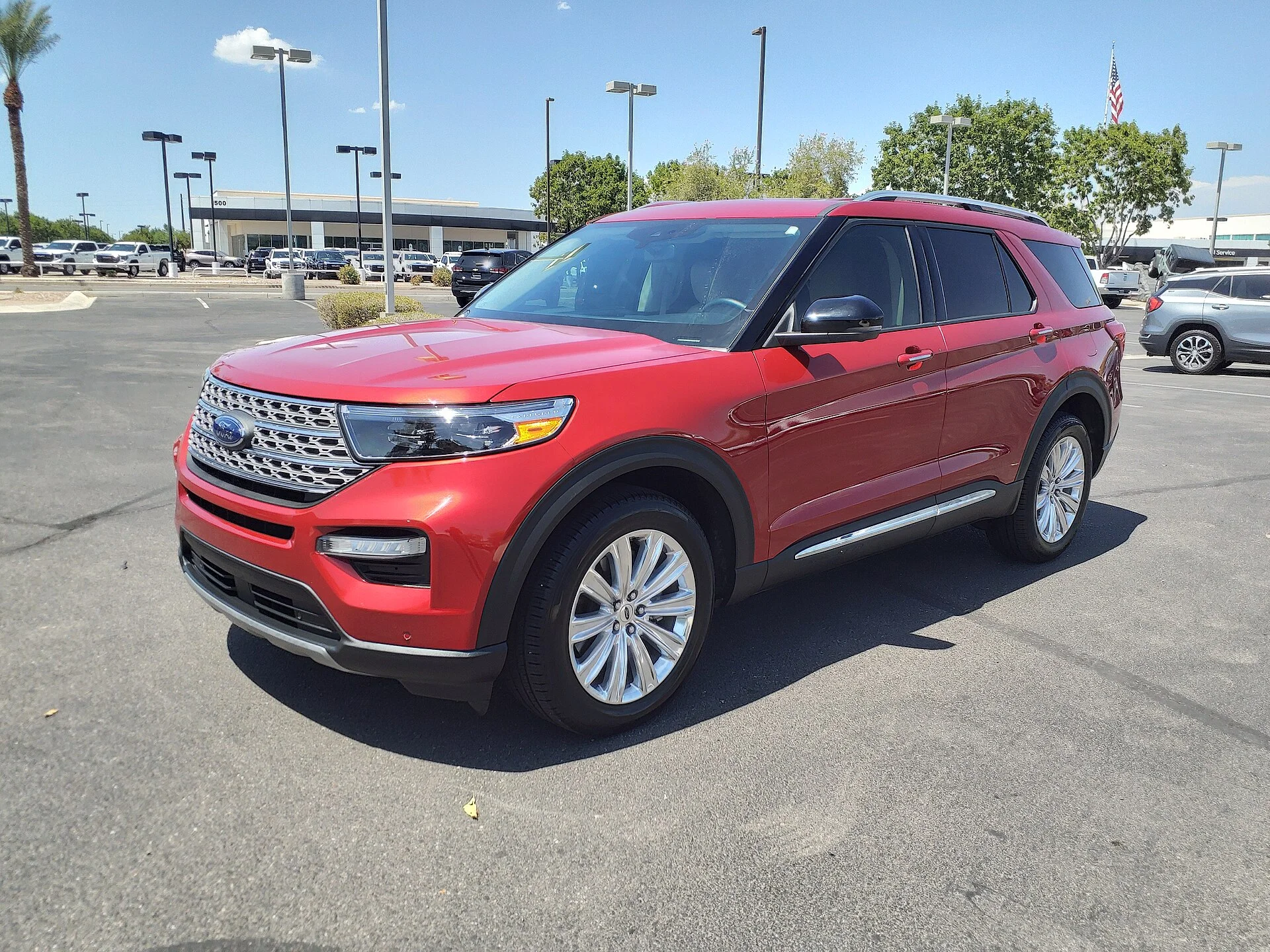 Ford Explorer Hybrid Limited — a red 2021 Explorer, front three-quarter view