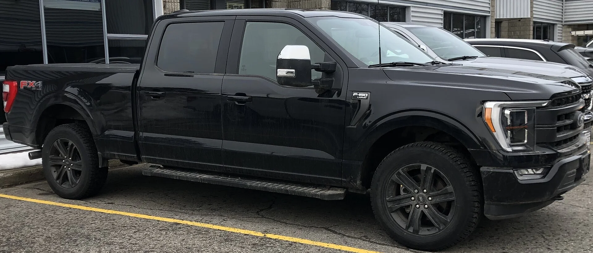 Black Ford F-150 Lariat FX4 crew cab, front
