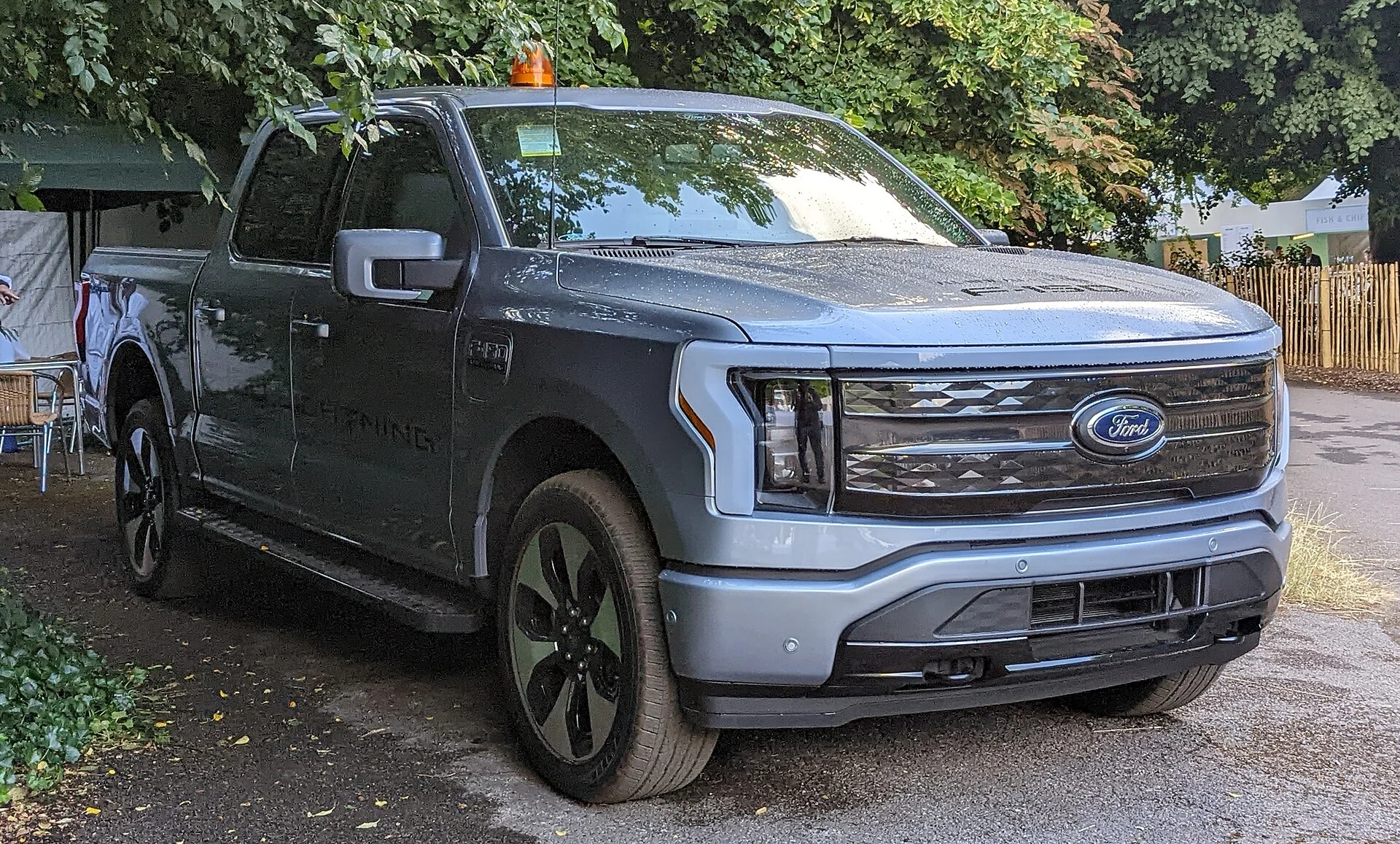 Ford F-150 Lightning — a grey 2022 Lightning, front three-quarter view