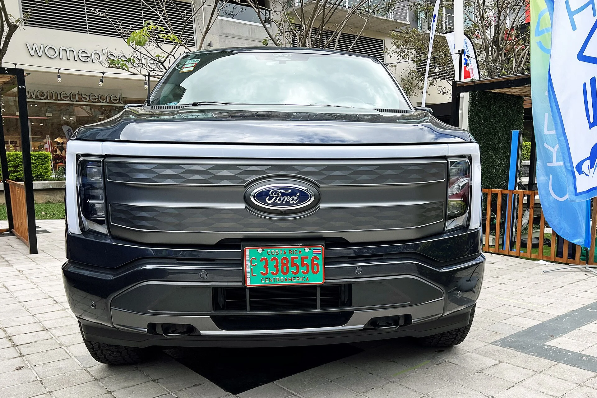Ford F-150 Lightning — a dark-grey 2023 Lightning, front view