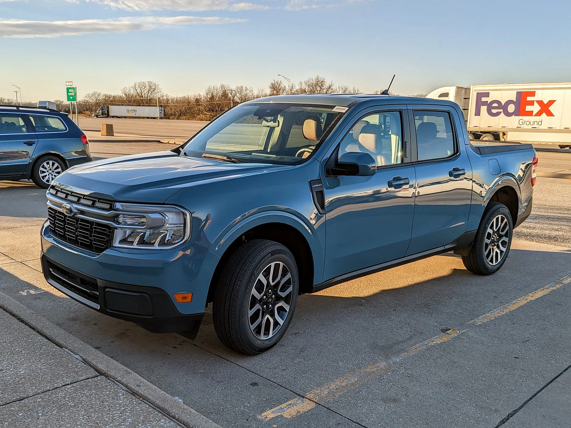 Ford Maverick Lariat — a blue 2022 Maverick, side three-quarter view