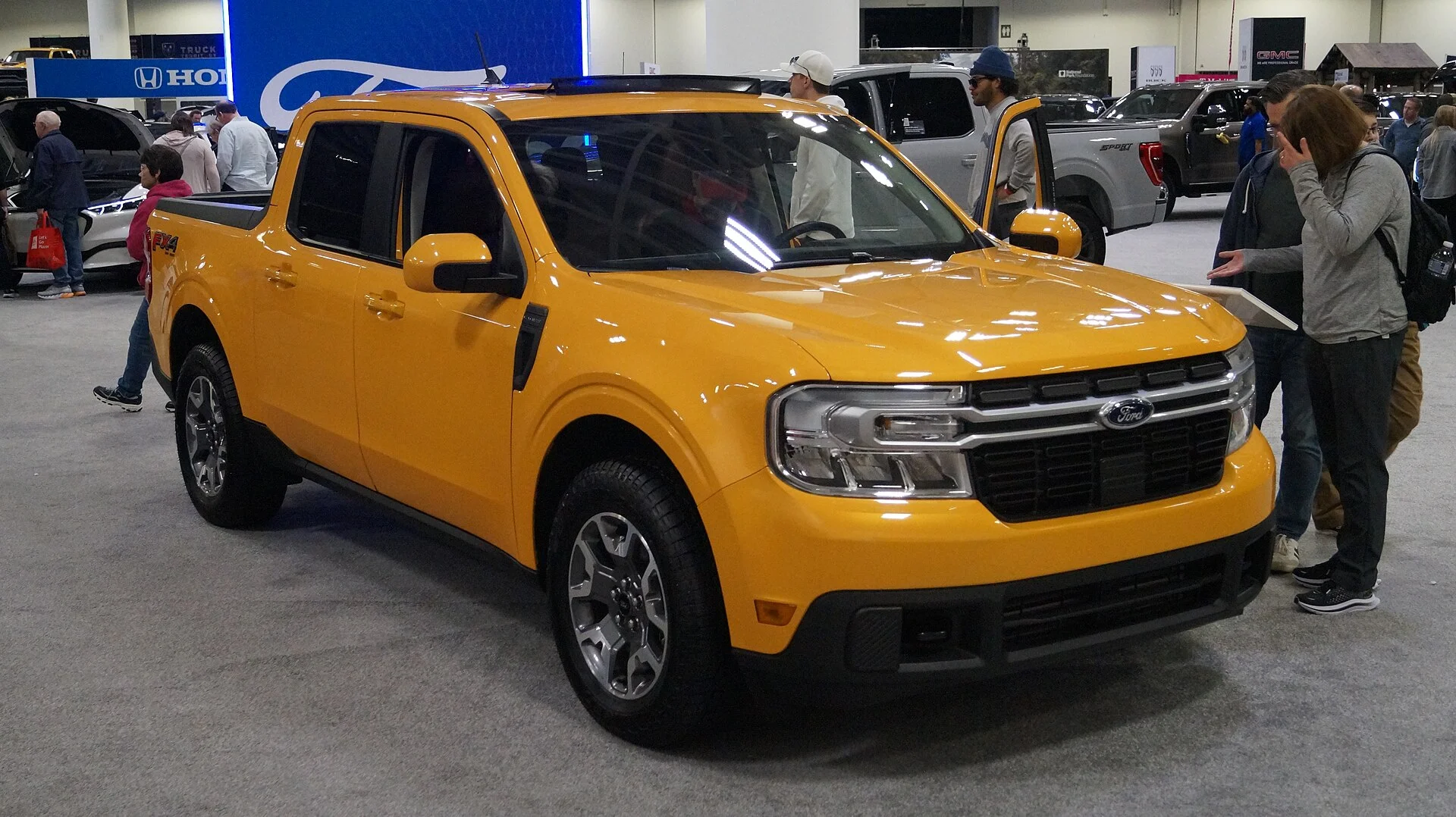 Ford Maverick Lariat — a yellow 2022 Maverick, front three-quarter view