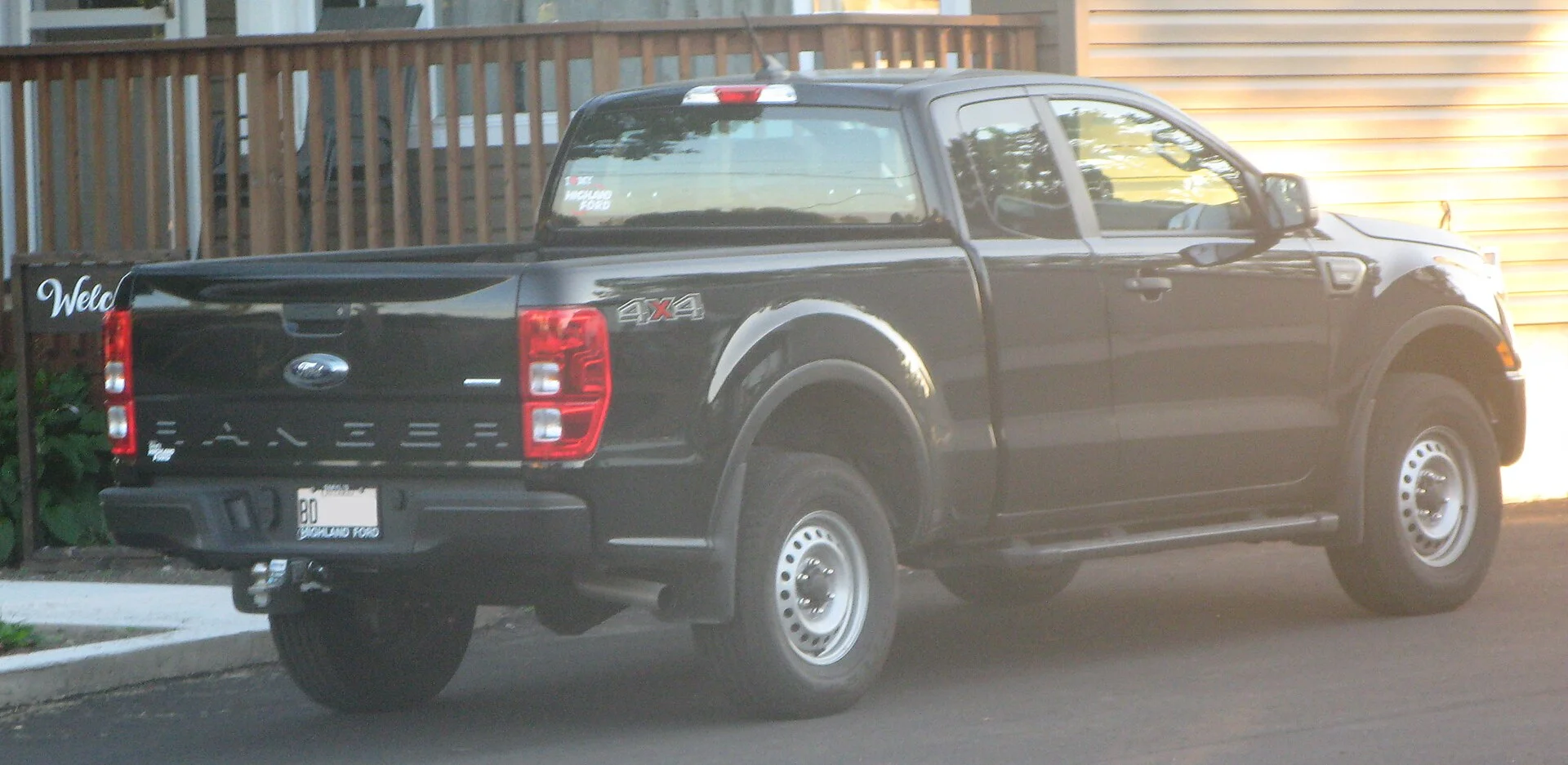 Grey Ford Ranger SuperCab rear view showing the tailgate and hitch area (2020)