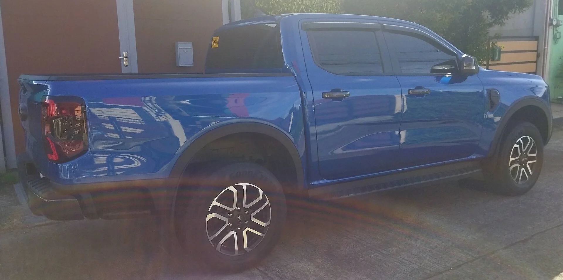Blue Ford Ranger pickup, side profile (2022)