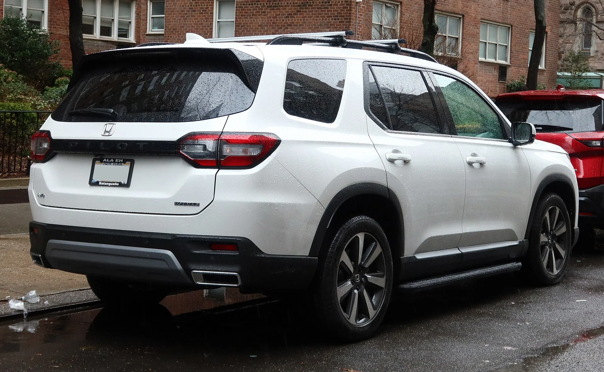 Honda Pilot Touring — a white 2023 Pilot, rear three-quarter view