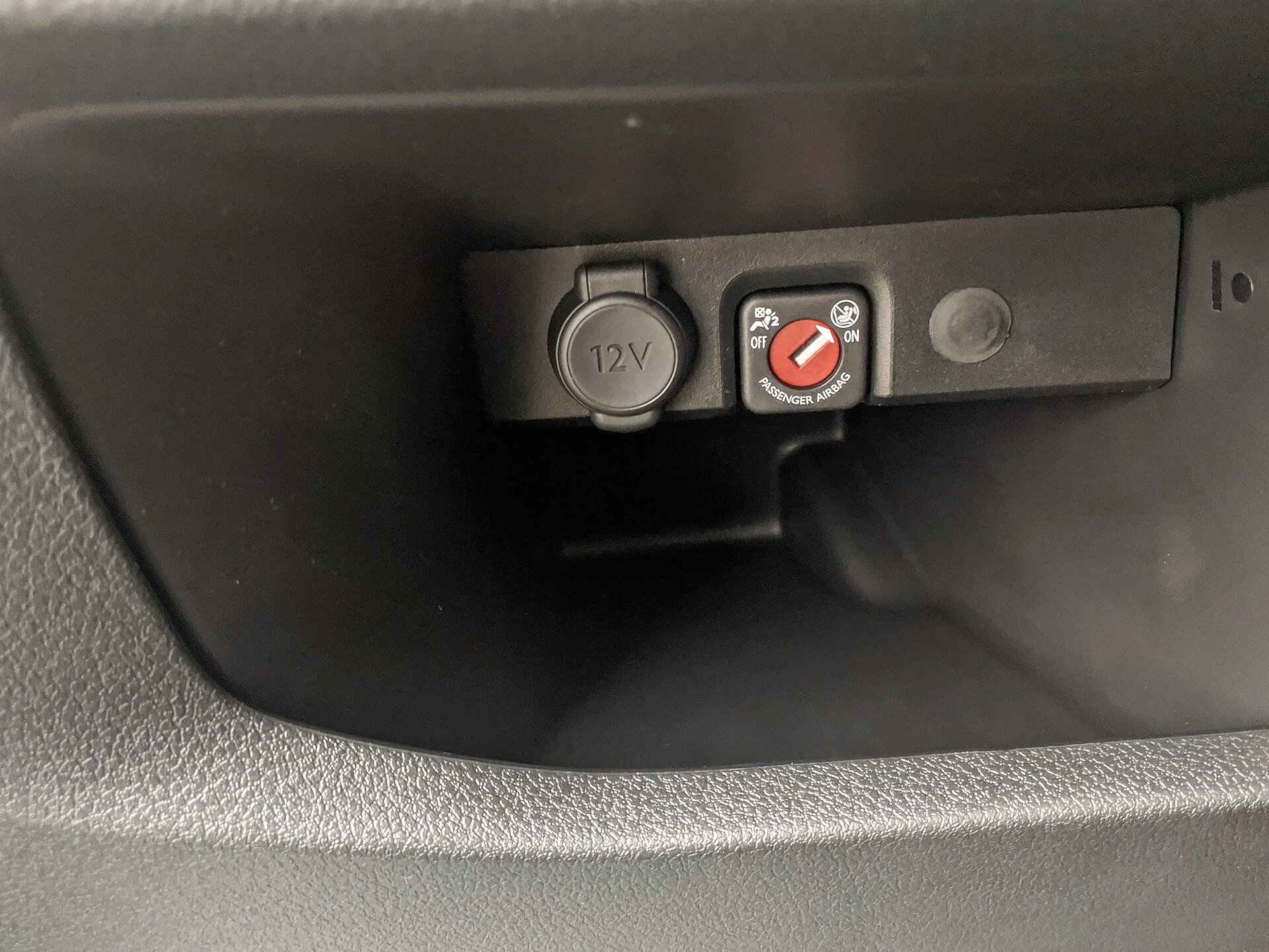 A car's 12-volt accessory socket, the in-car outlet a dash cam's charging cable draws from