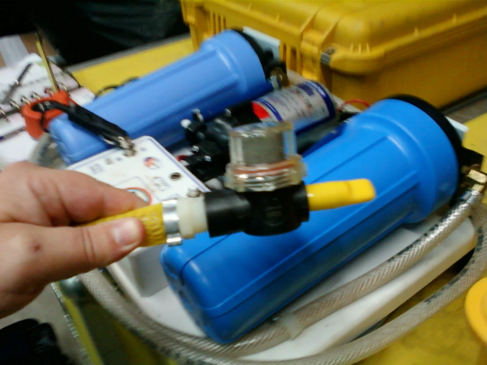 Img-0037 A Noah backpack portable water purification unit, which includes a ceramic filter and a high intensity U.V. light source to render microorganisms inert
