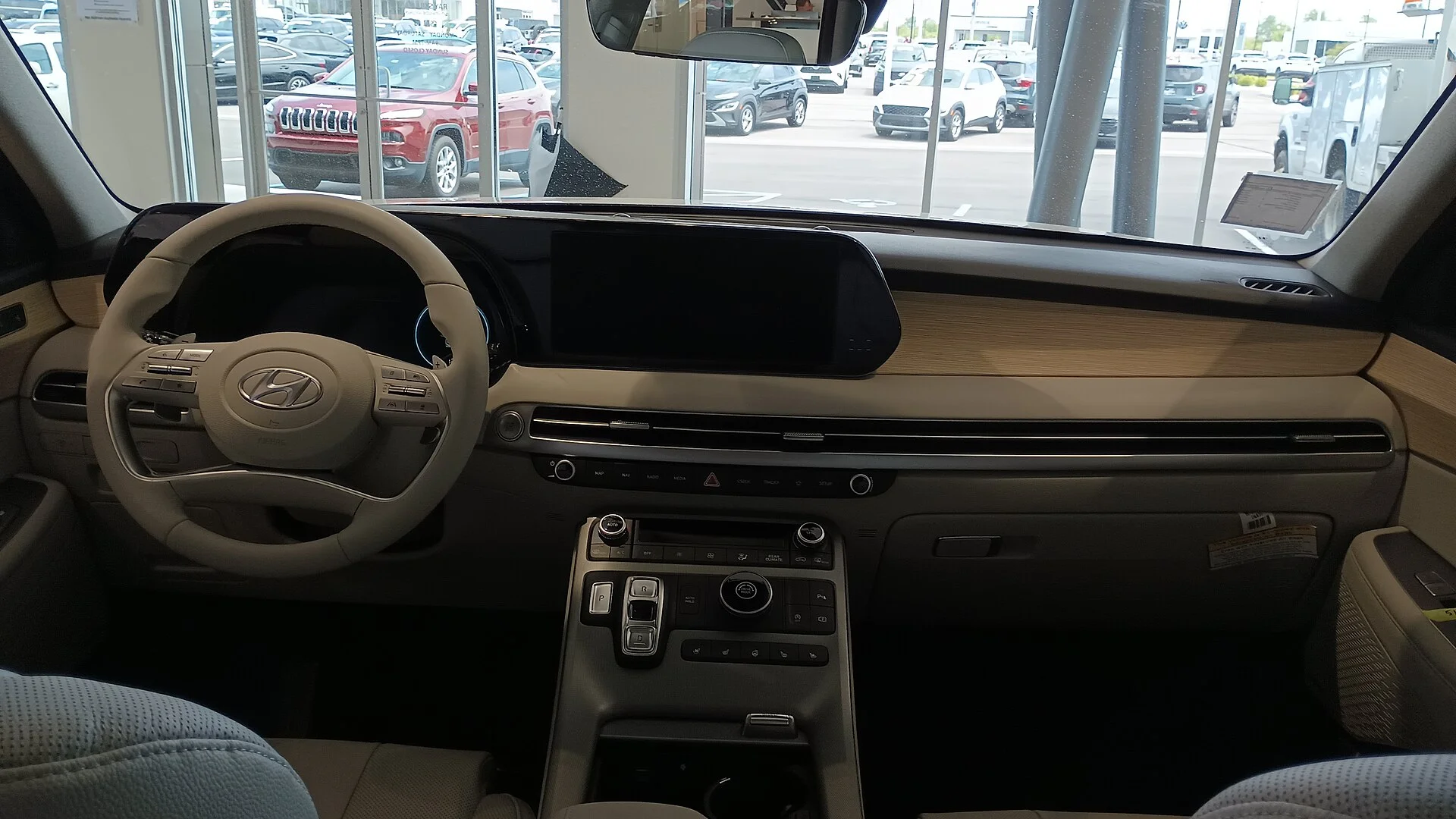 Hyundai Palisade interior — the driver-side dashboard and console of a 2023 Palisade