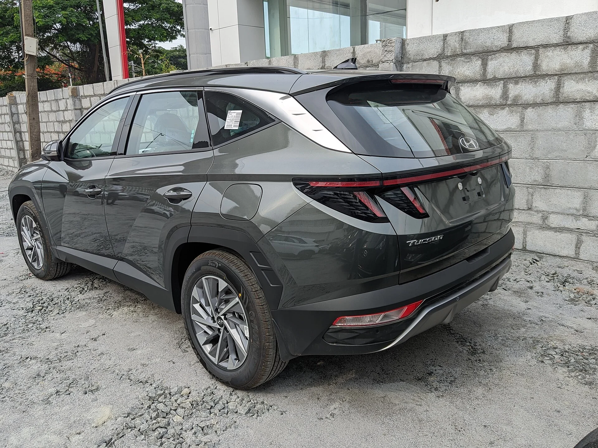 A Hyundai Tucson (NX4) rear three-quarter, the cargo end this guide measures for sleeping
