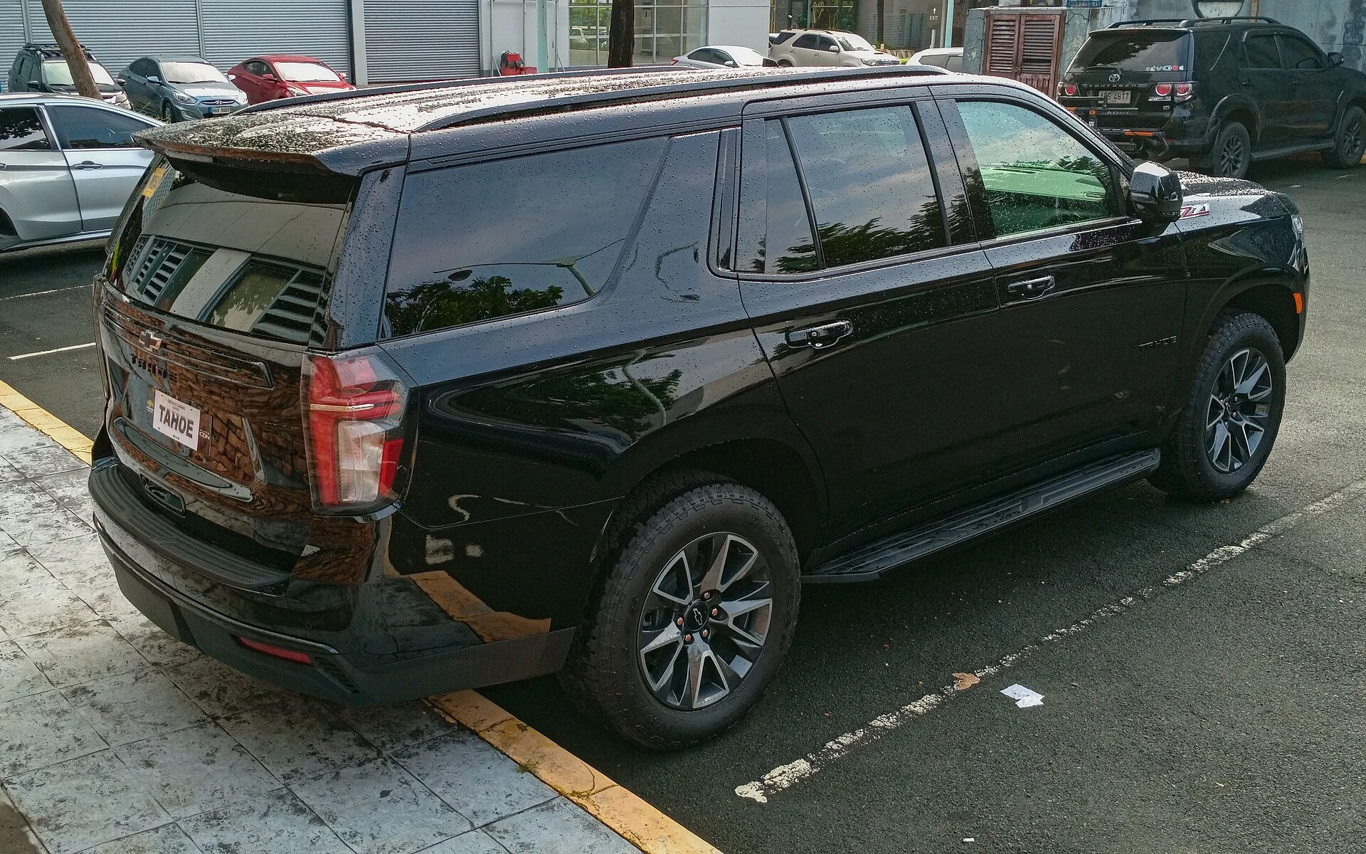 Black Chevy Tahoe Z71, current generation, rear three-quarter view
