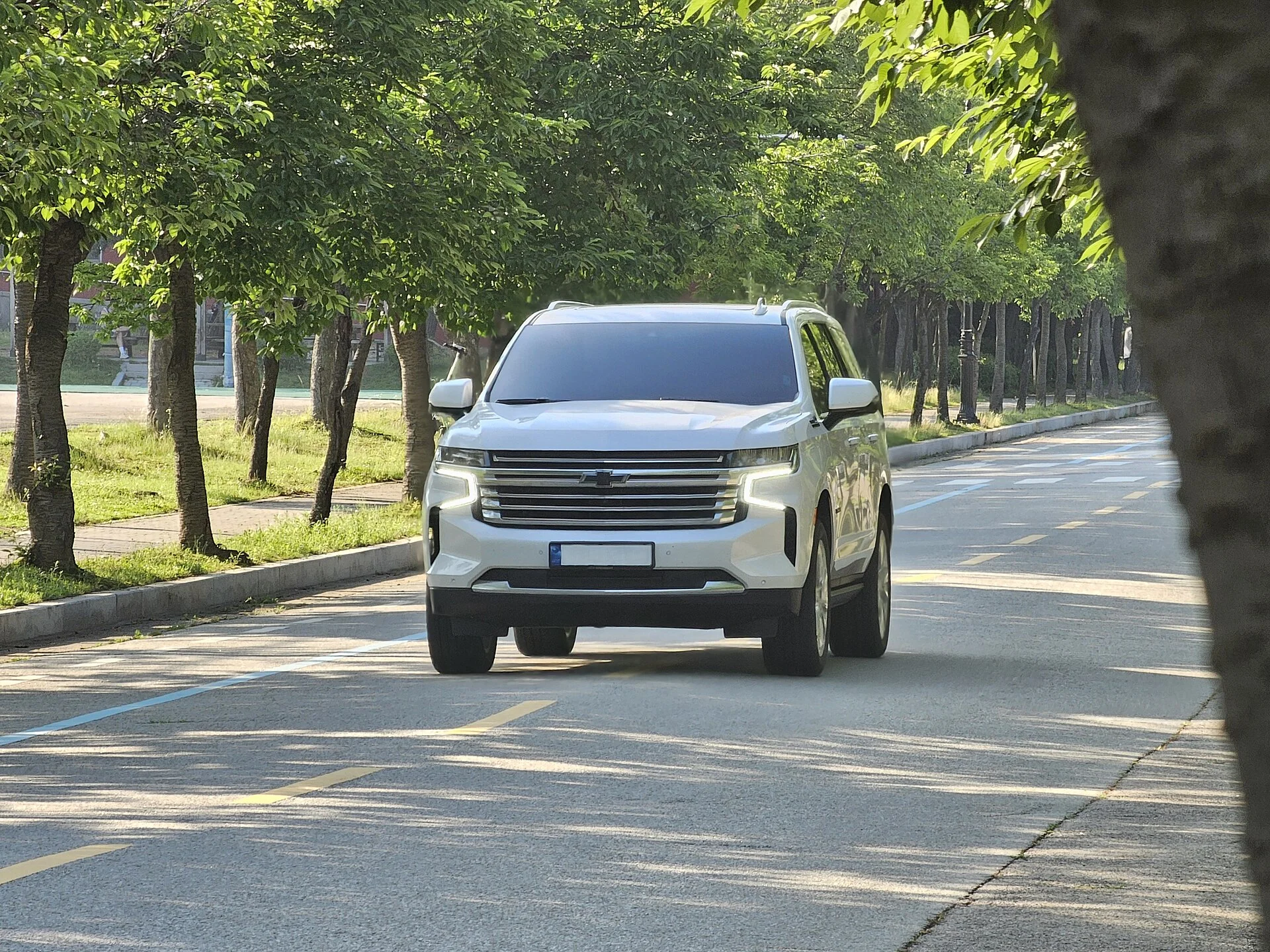 White Chevy Tahoe High Country, current generation, front three-quarter view