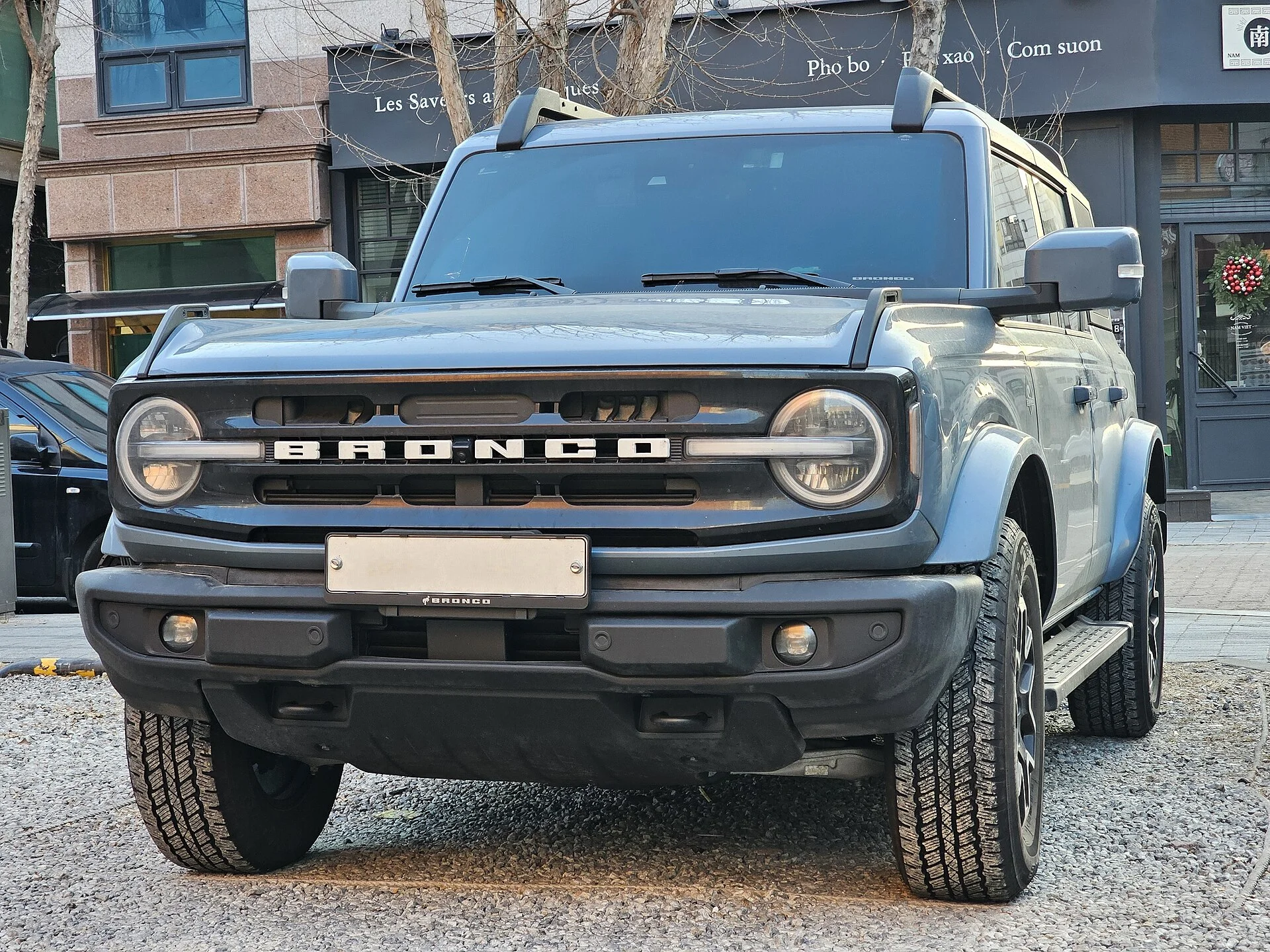 Grey Ford Bronco Outer Banks four-door, front three-quarter view