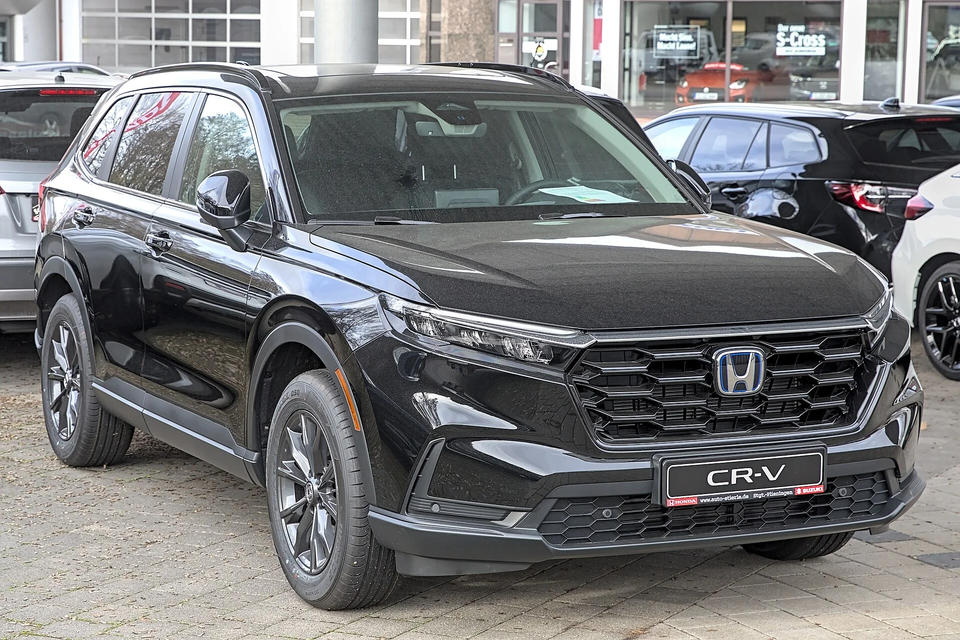 Black Honda CR-V hybrid, sixth generation, front three-quarter view