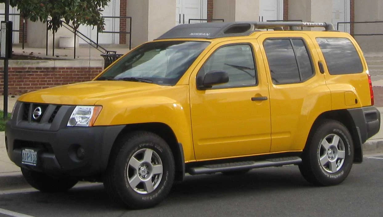 Yellow Nissan Xterra, second generation, front three-quarter view