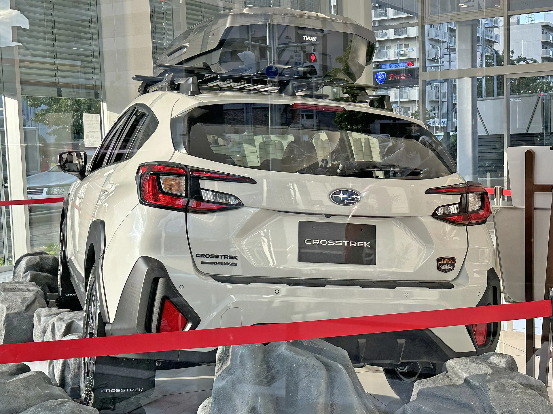 White Subaru Crosstrek Wilderness, current generation, rear three-quarter view