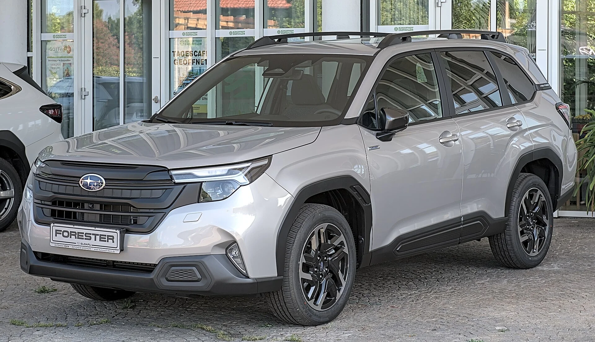 Subaru Forester (2024, SL generation) in silver, front three-quarter view
