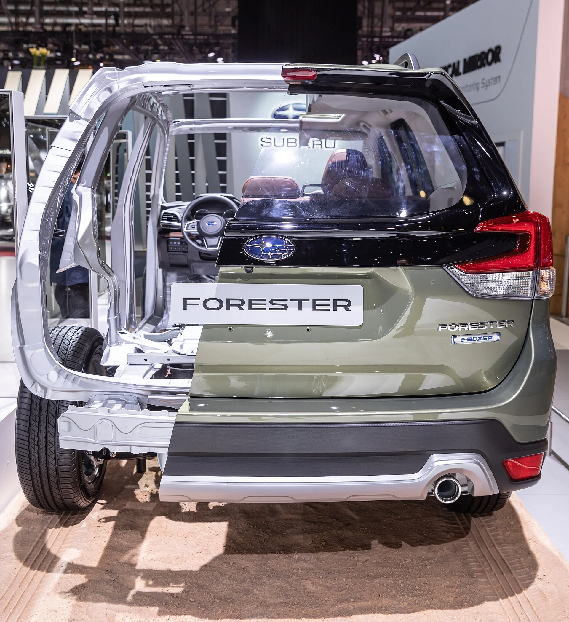 Subaru Forester (SK generation) in olive green, rear view with the tailgate open