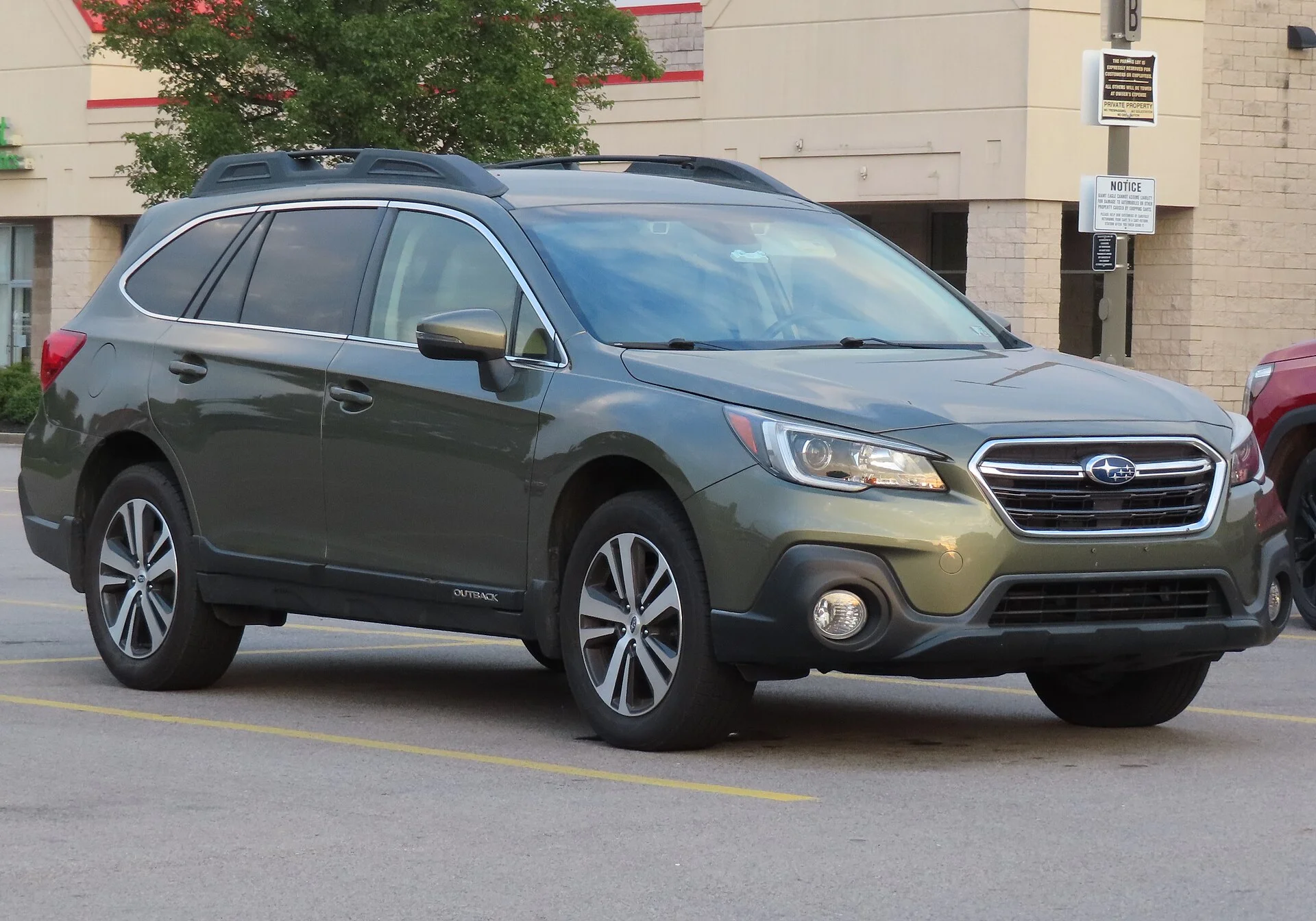 A green Subaru Outback, a capable winter camping base