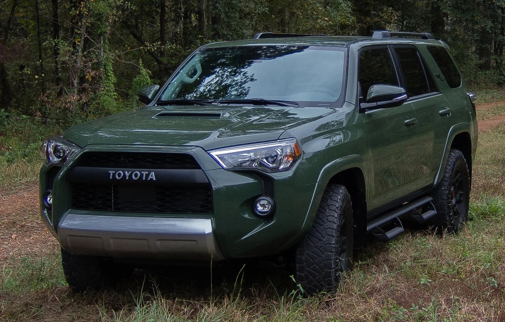 Army Green Toyota 4Runner TRD Pro, front three-quarter view outdoors