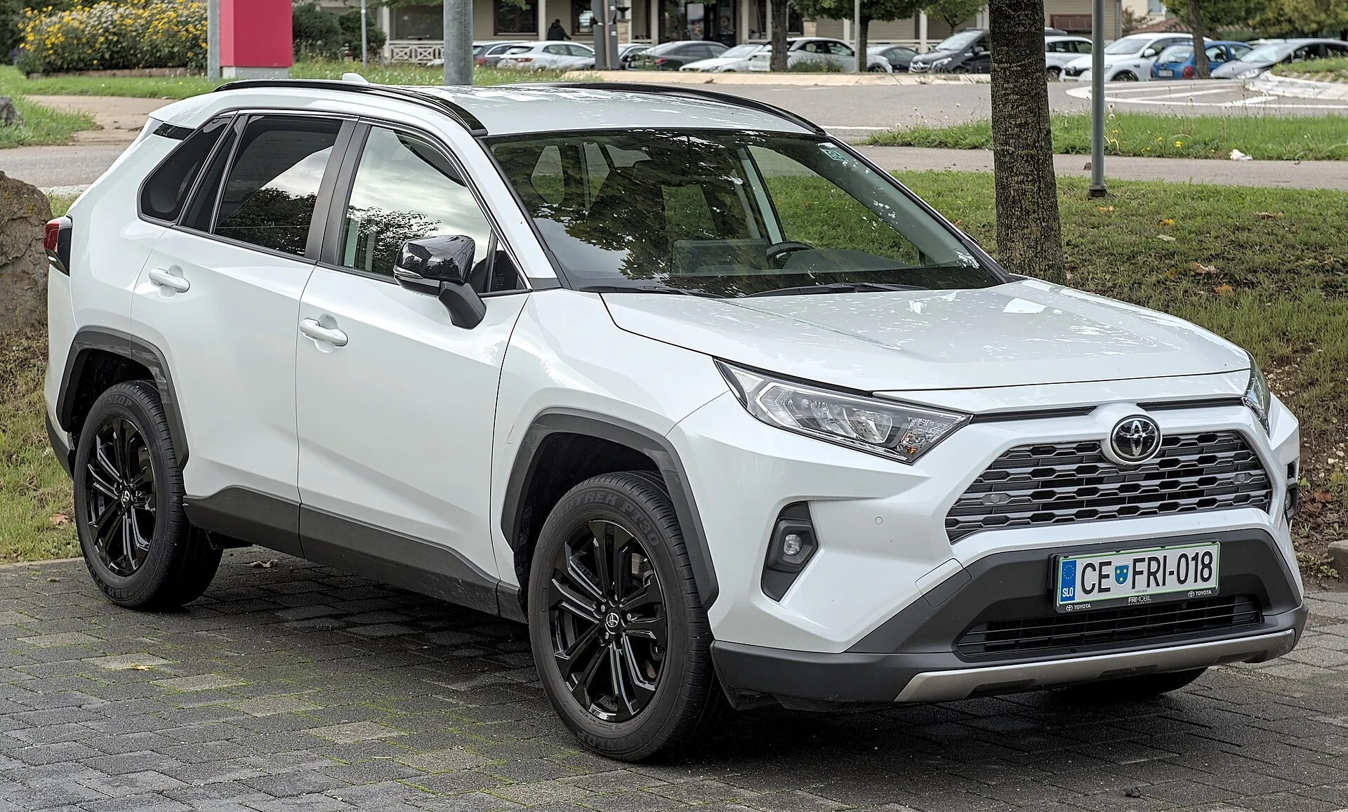 White Toyota RAV4, current generation, front three-quarter view