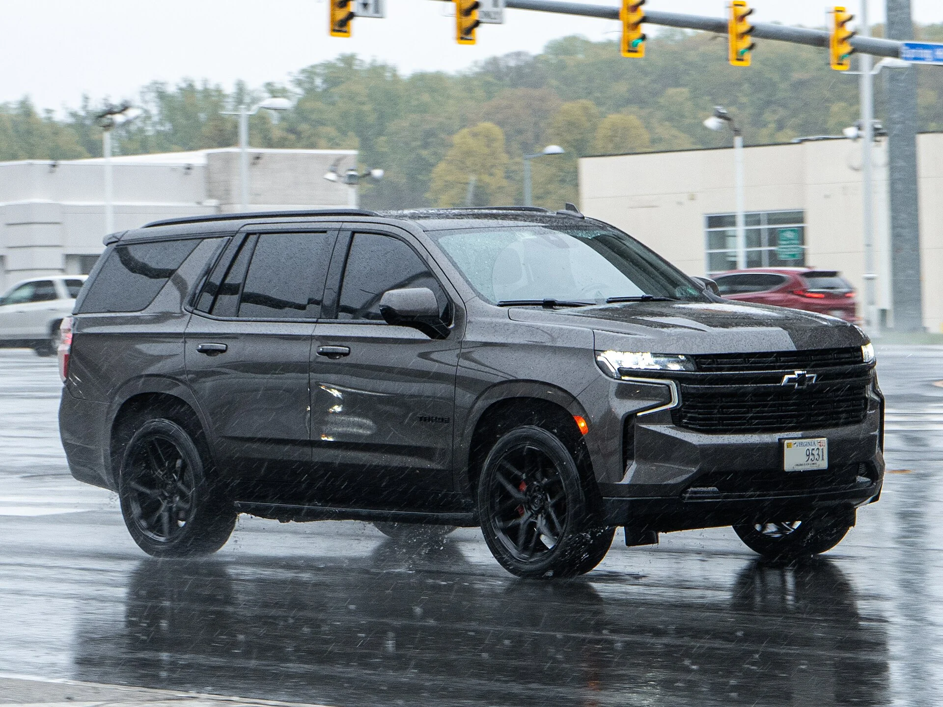 Dark grey Chevy Tahoe, current generation, front three-quarter view