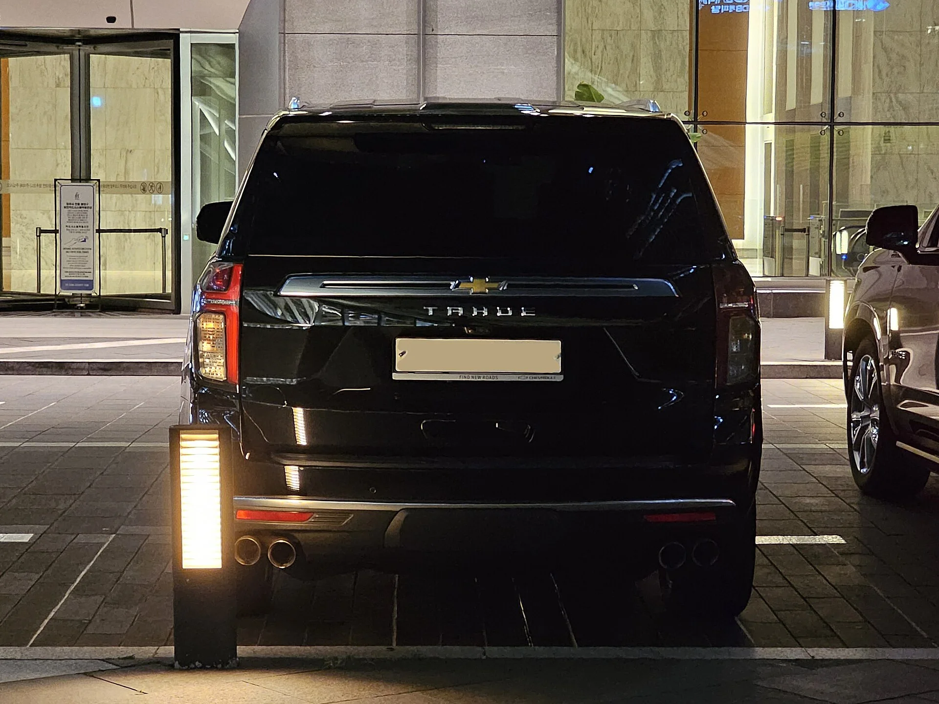 Black Chevy Tahoe, current generation, rear view