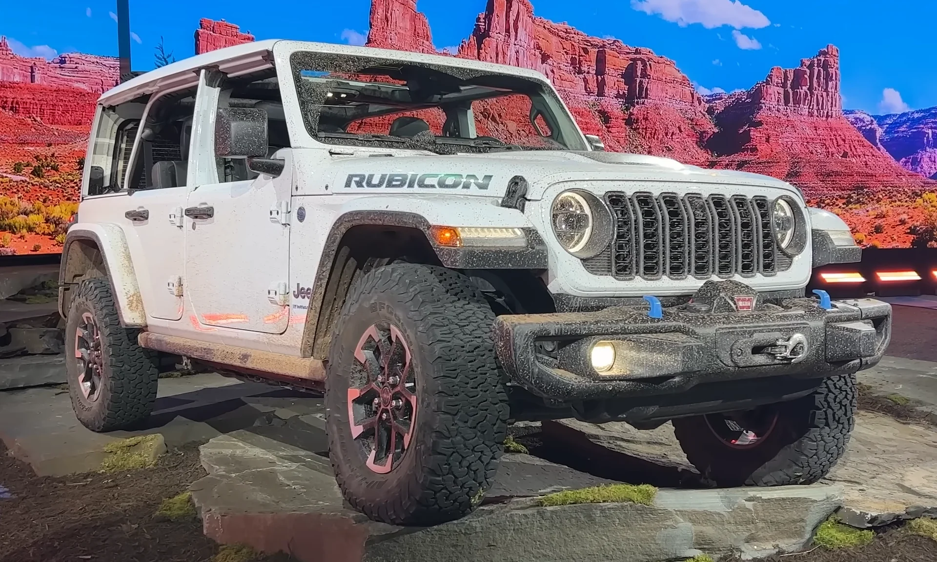 A white Jeep Wrangler Rubicon in the desert