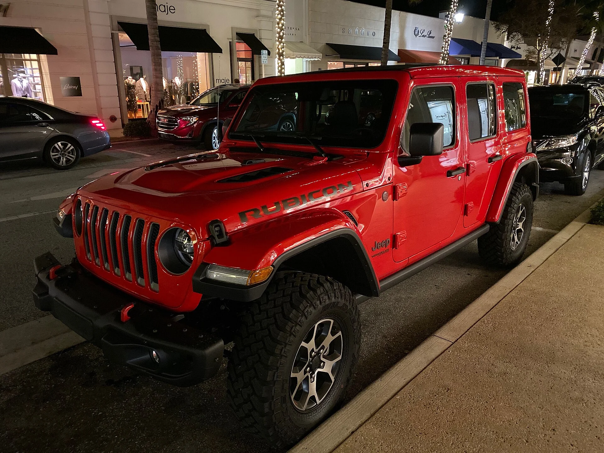 A red Jeep Wrangler Unlimited front