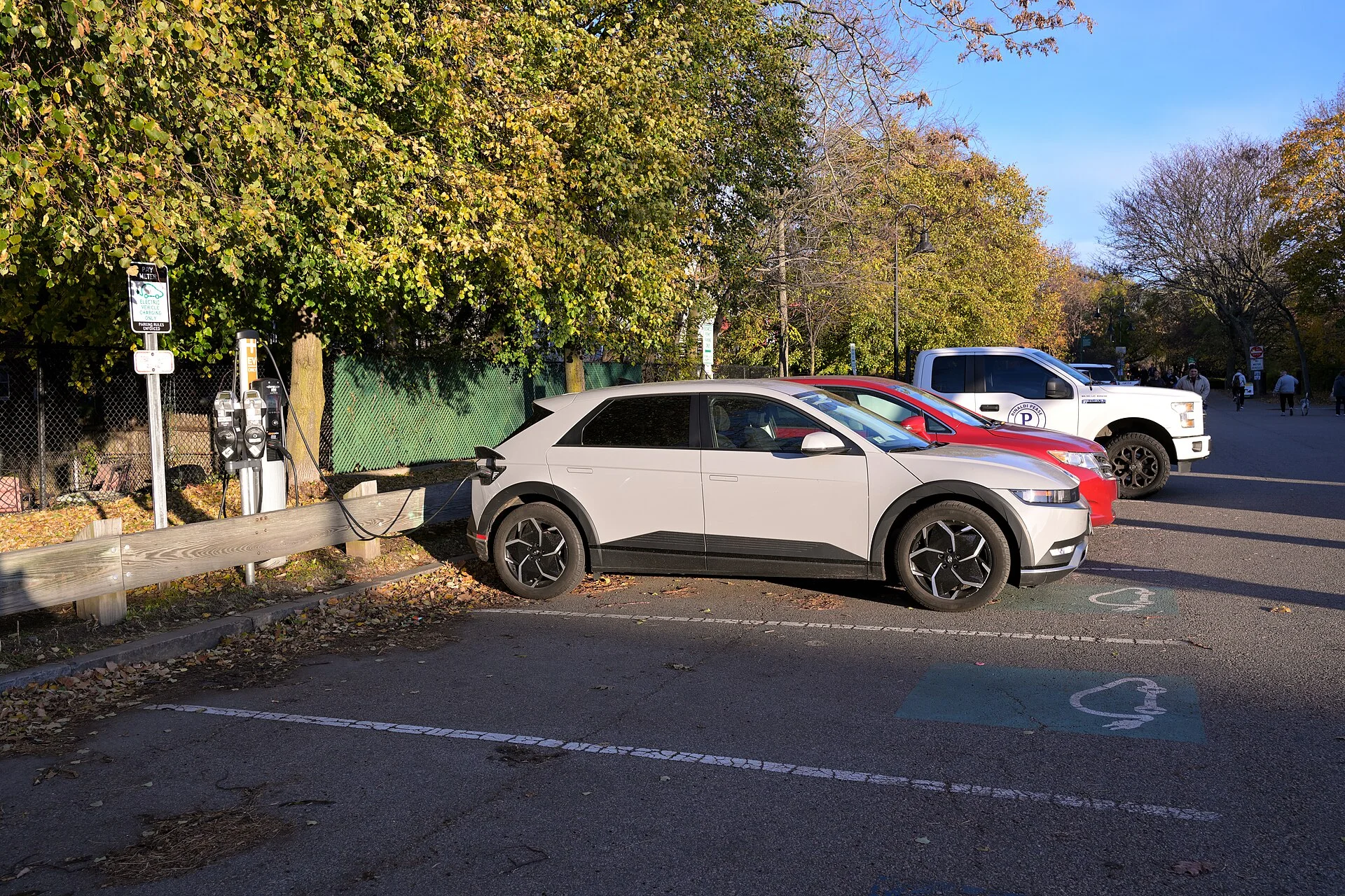 Hyundai Ioniq 5 plugged into a charging station, side view