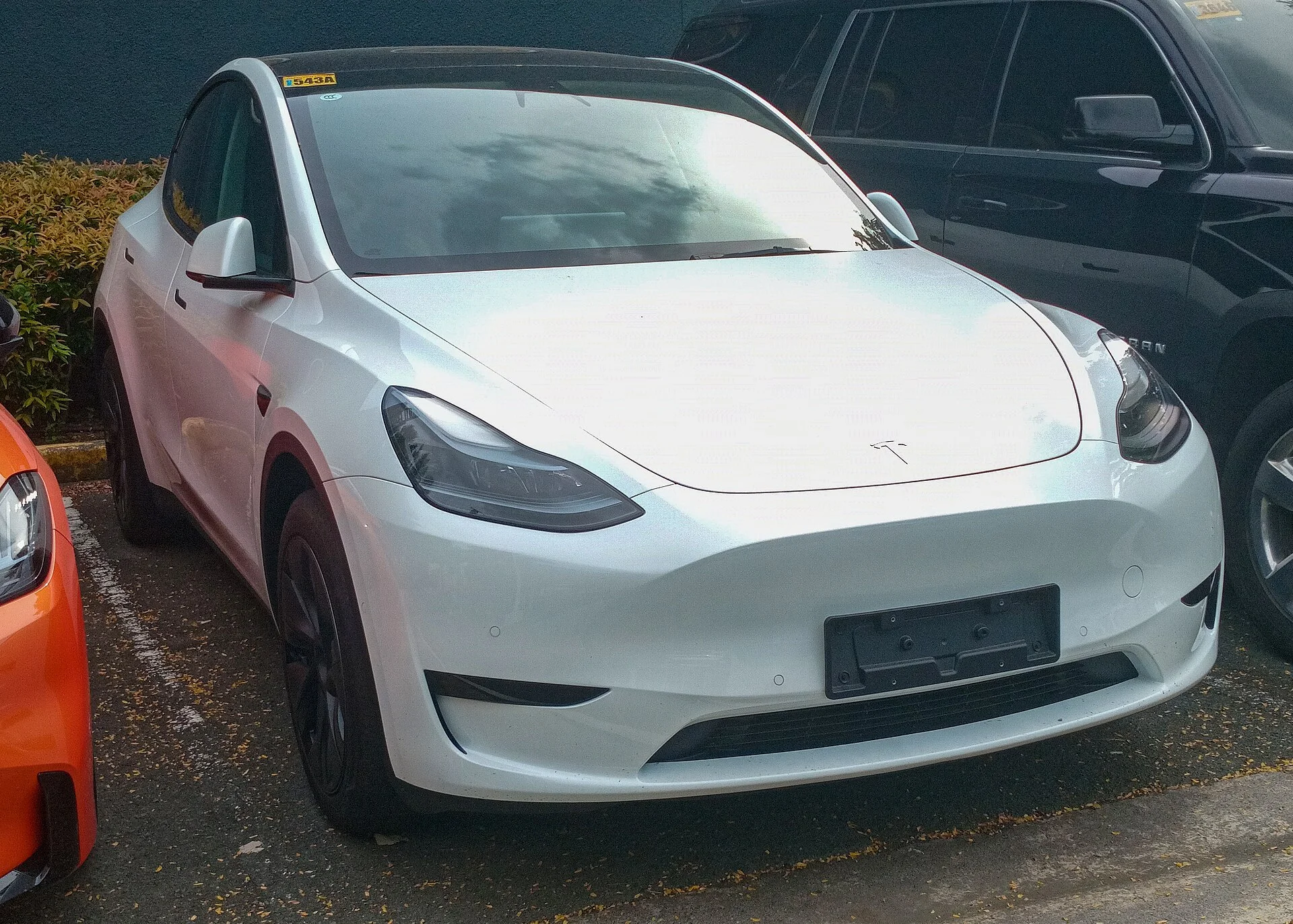 A white Tesla Model Y, safe for climate-on sleeping