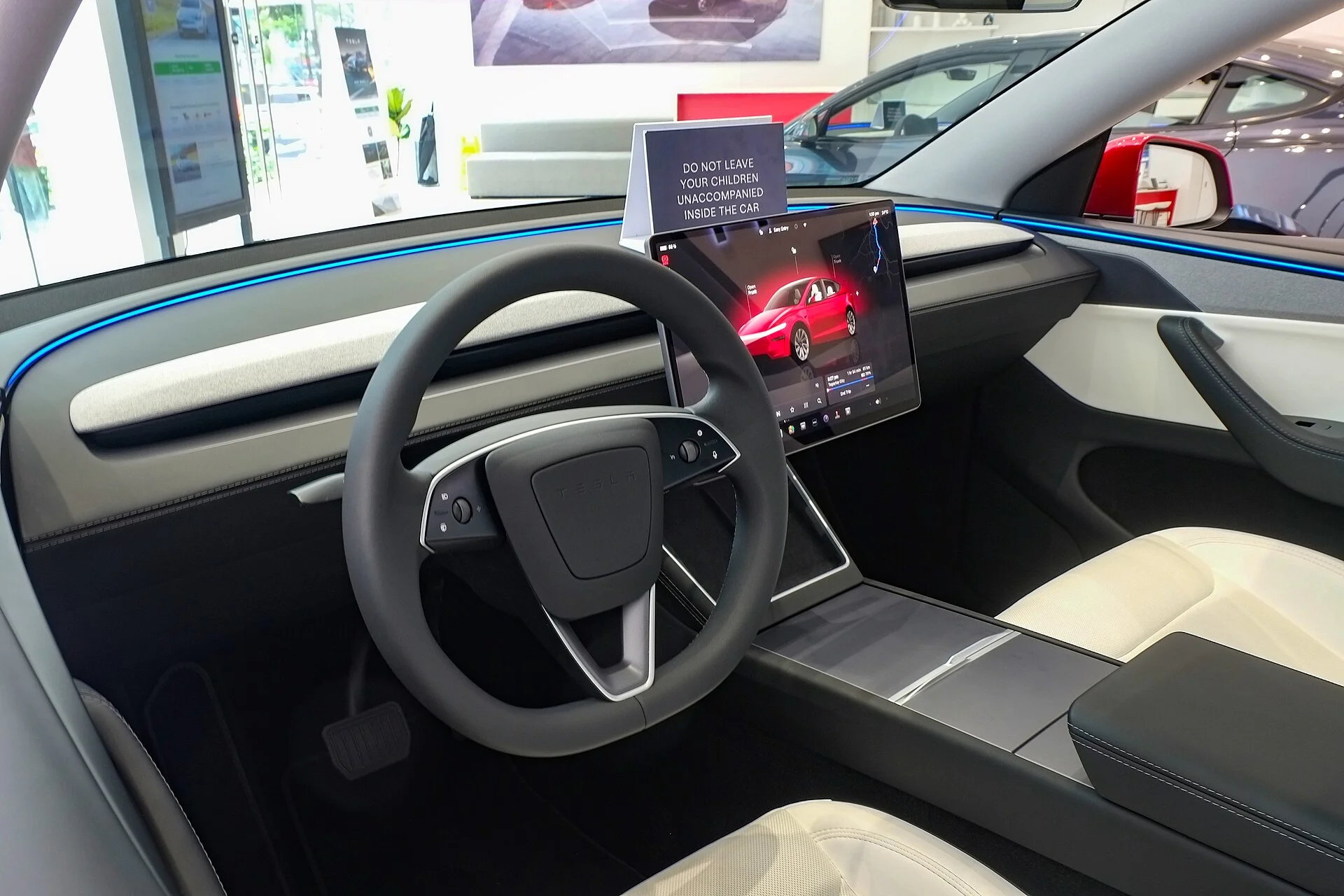 A Tesla Model Y interior and touchscreen that runs Camp Mode