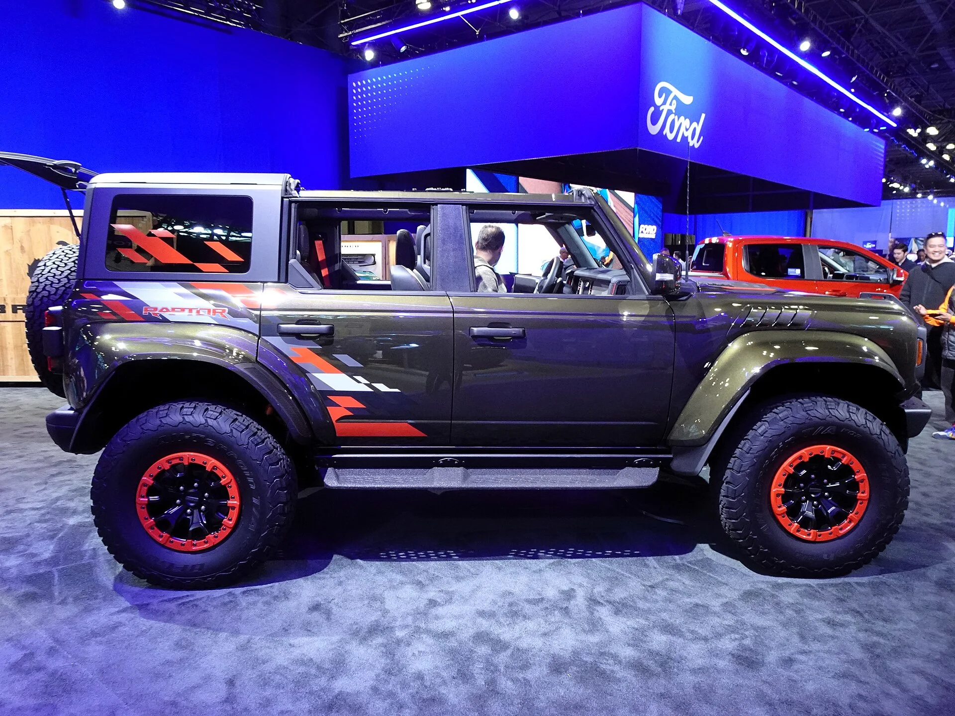 Blue-grey Ford Bronco Raptor, side view