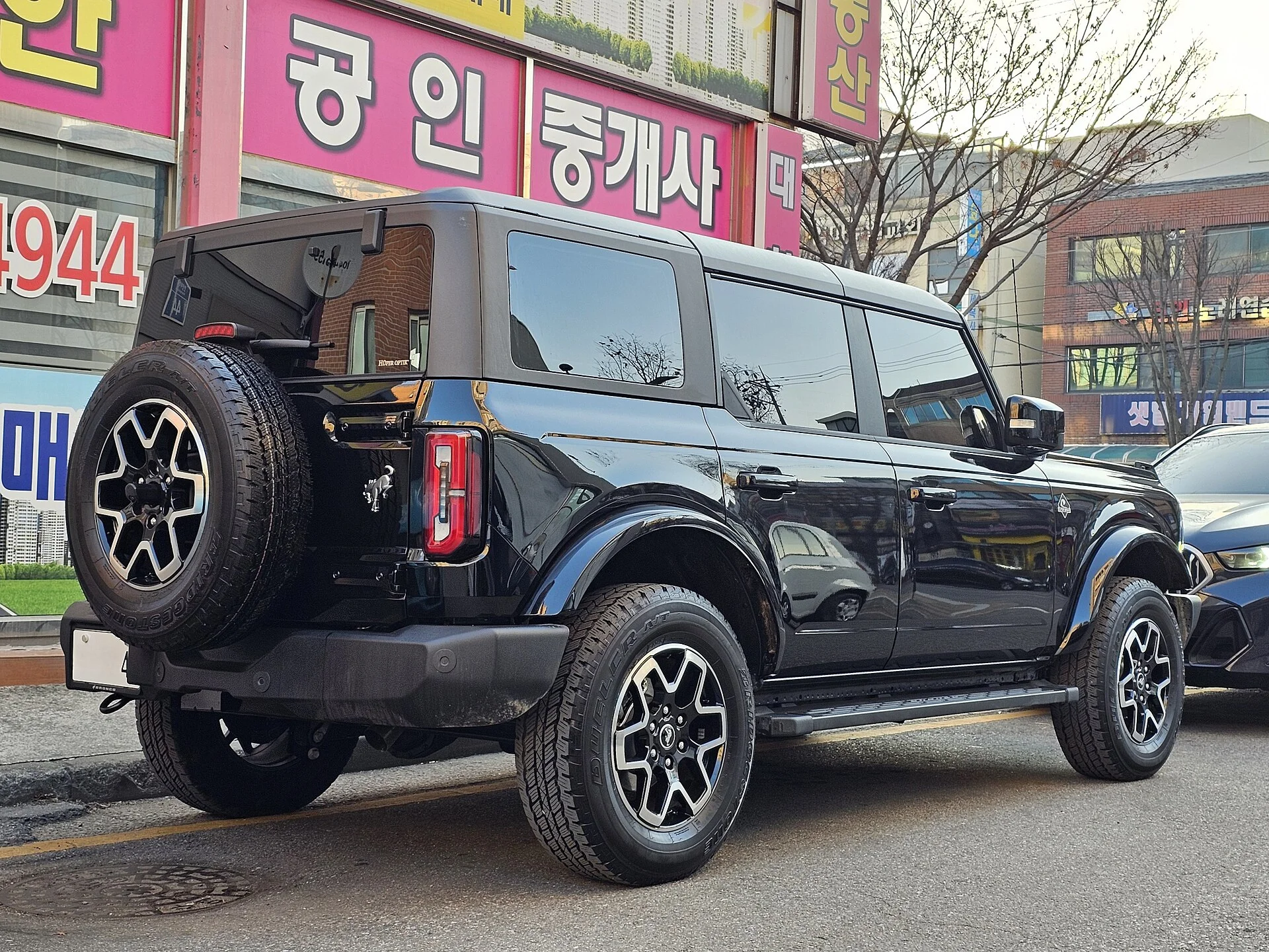 Black Ford Bronco Outer Banks four-door, side view